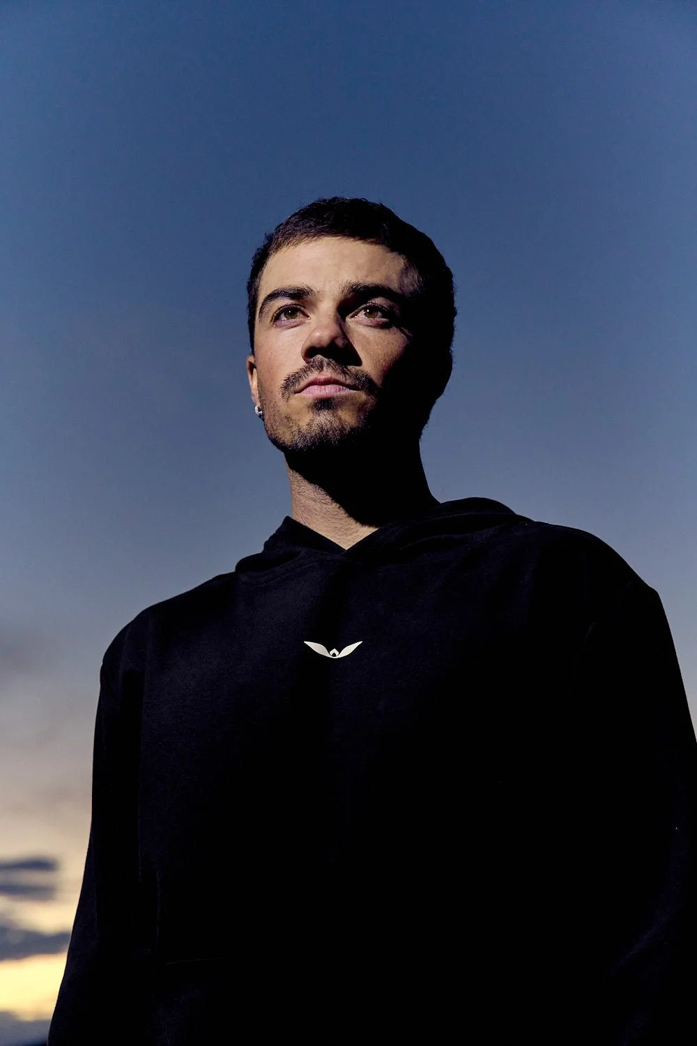 Commercial lifestyle shot of athlete in Unitus sportswear posing in Sedona at sunset