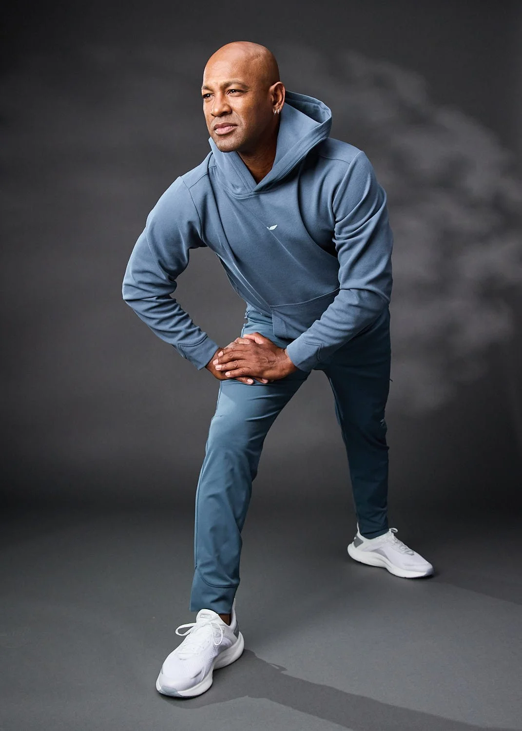 Men’s athletic gray blue hoodie, photographed with clean studio lighting