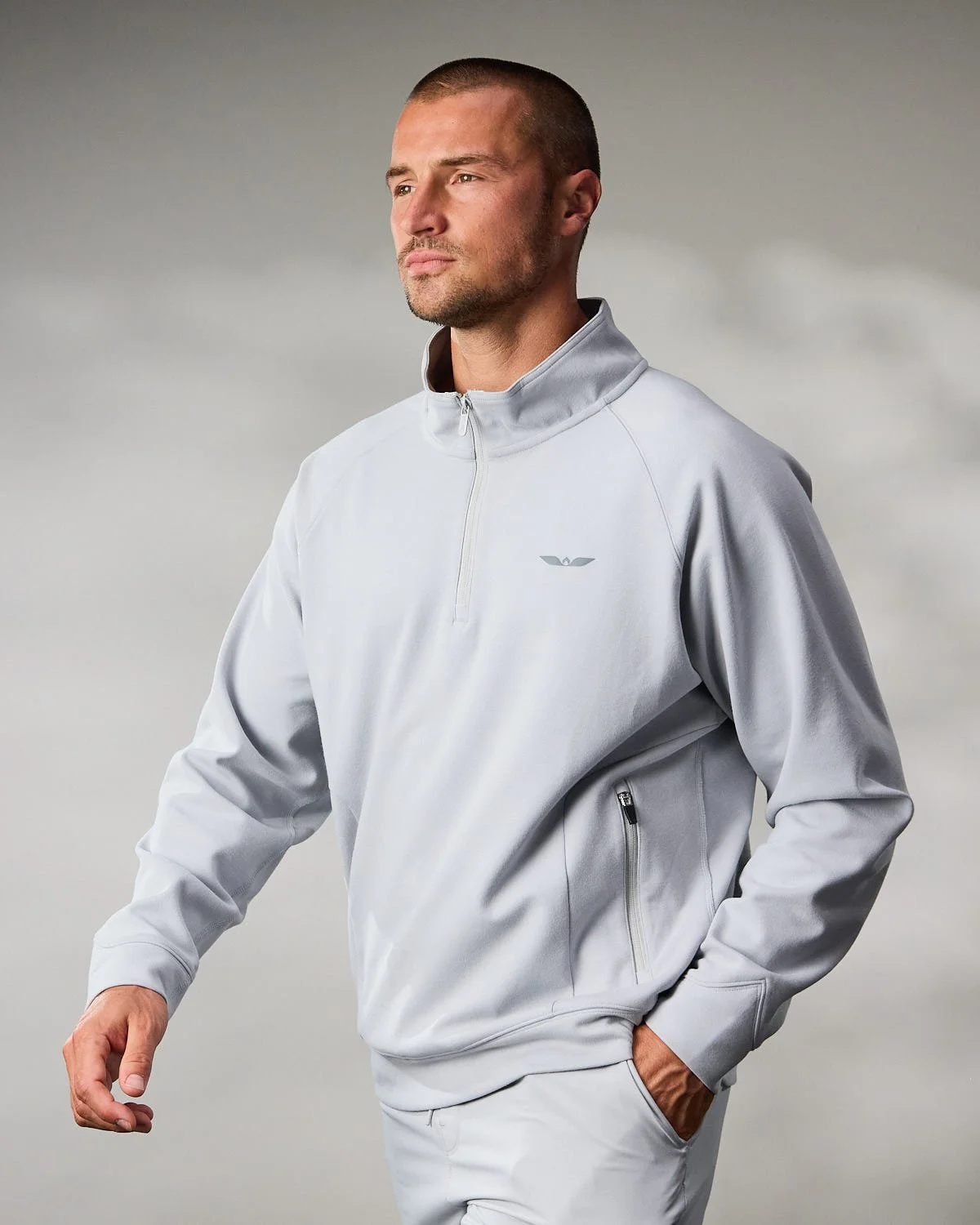 Men's white athletic jacket, photographed with clean studio lighting
