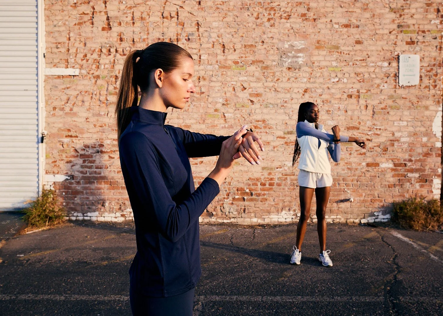 Runner checking tech sports watch in downtown phoenix, arizona