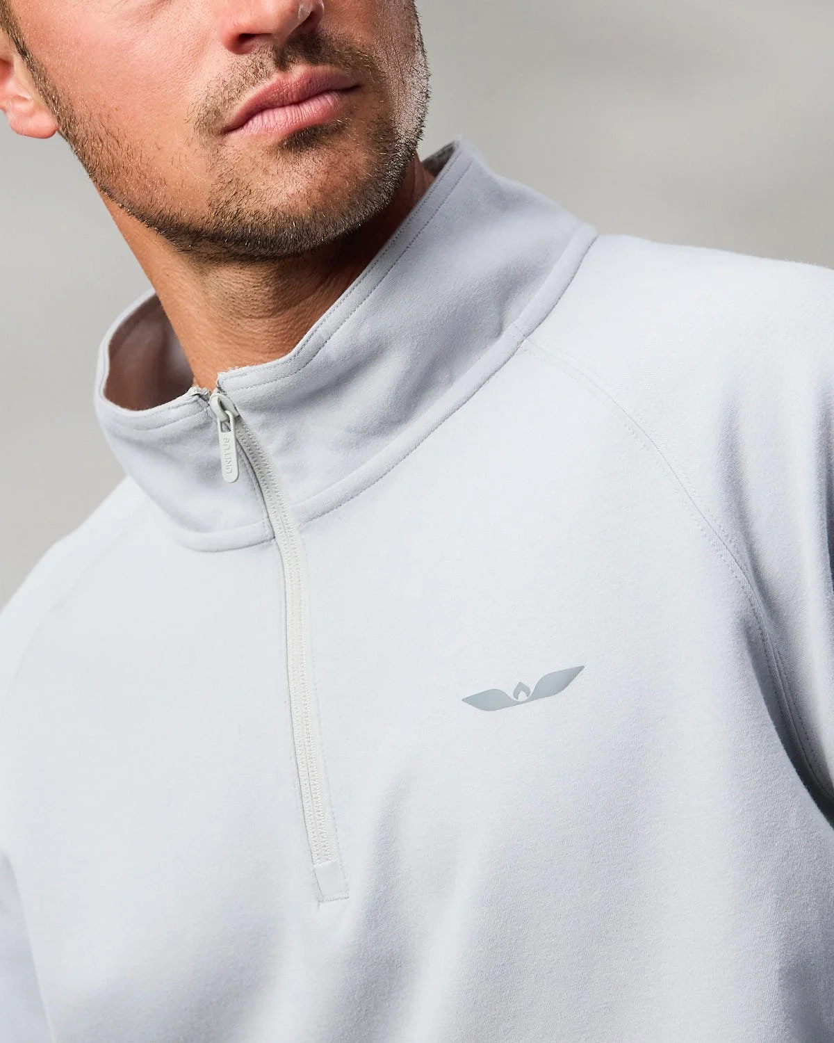 Men's white athletic jacket, photographed with clean studio lighting