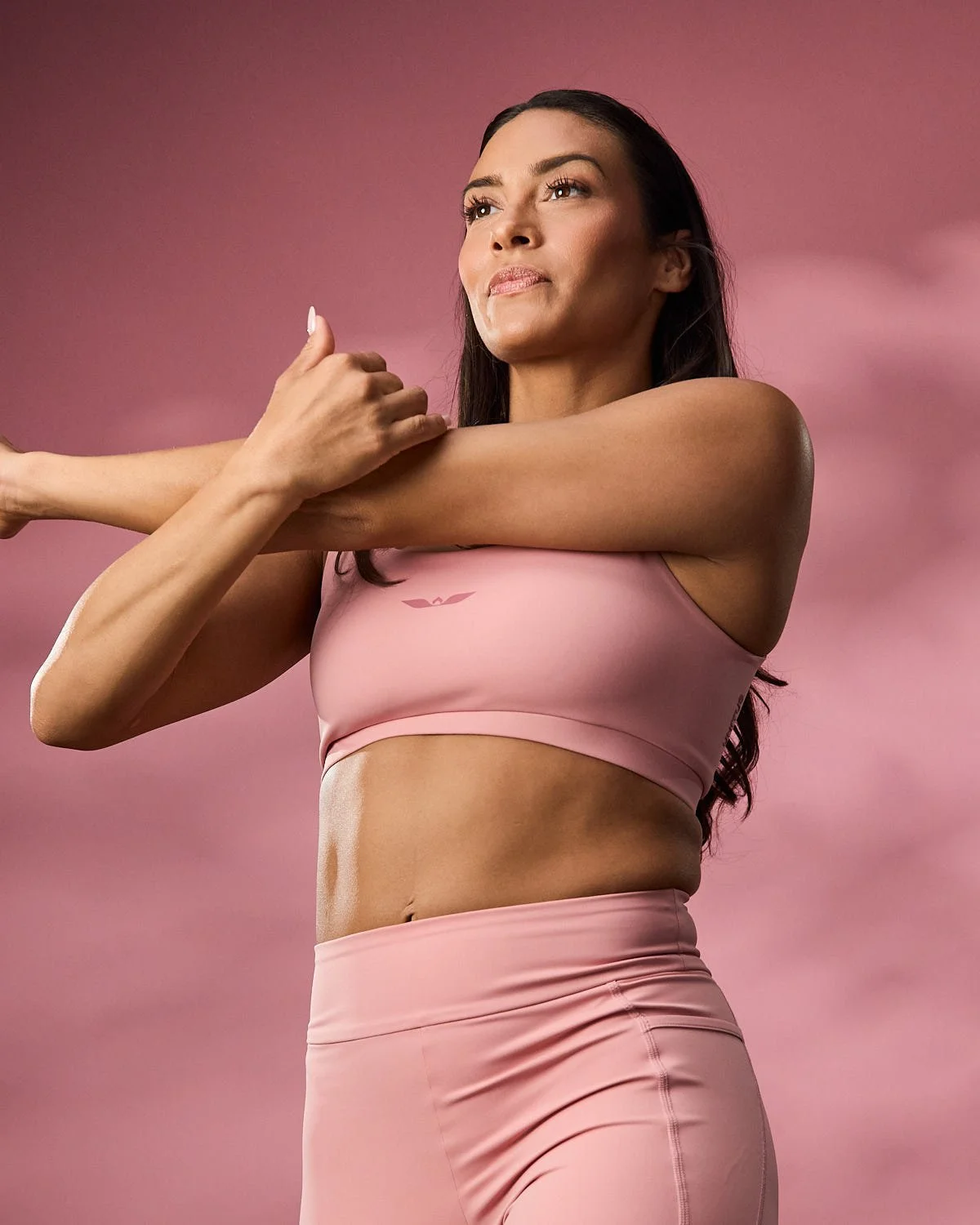 Women’s athletic pink sports bra, photographed with clean studio lighting