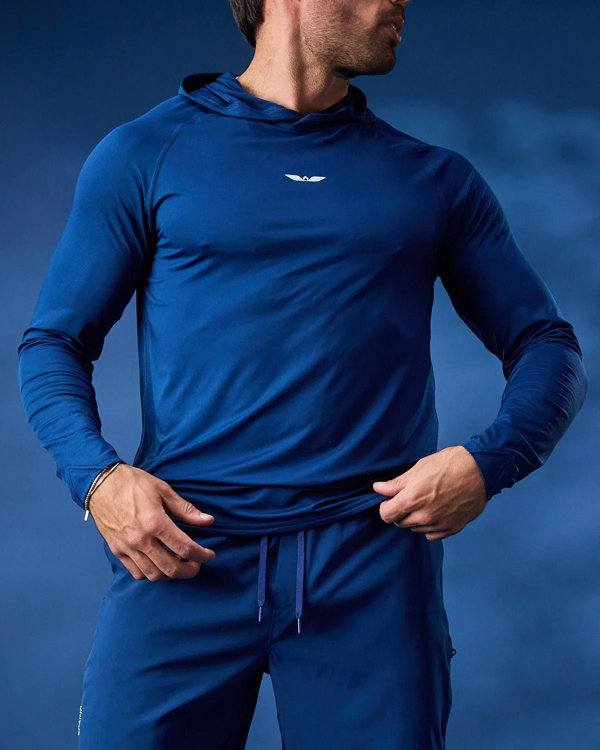 Men’s athletic royal blue long sleeve, photographed with clean studio lighting