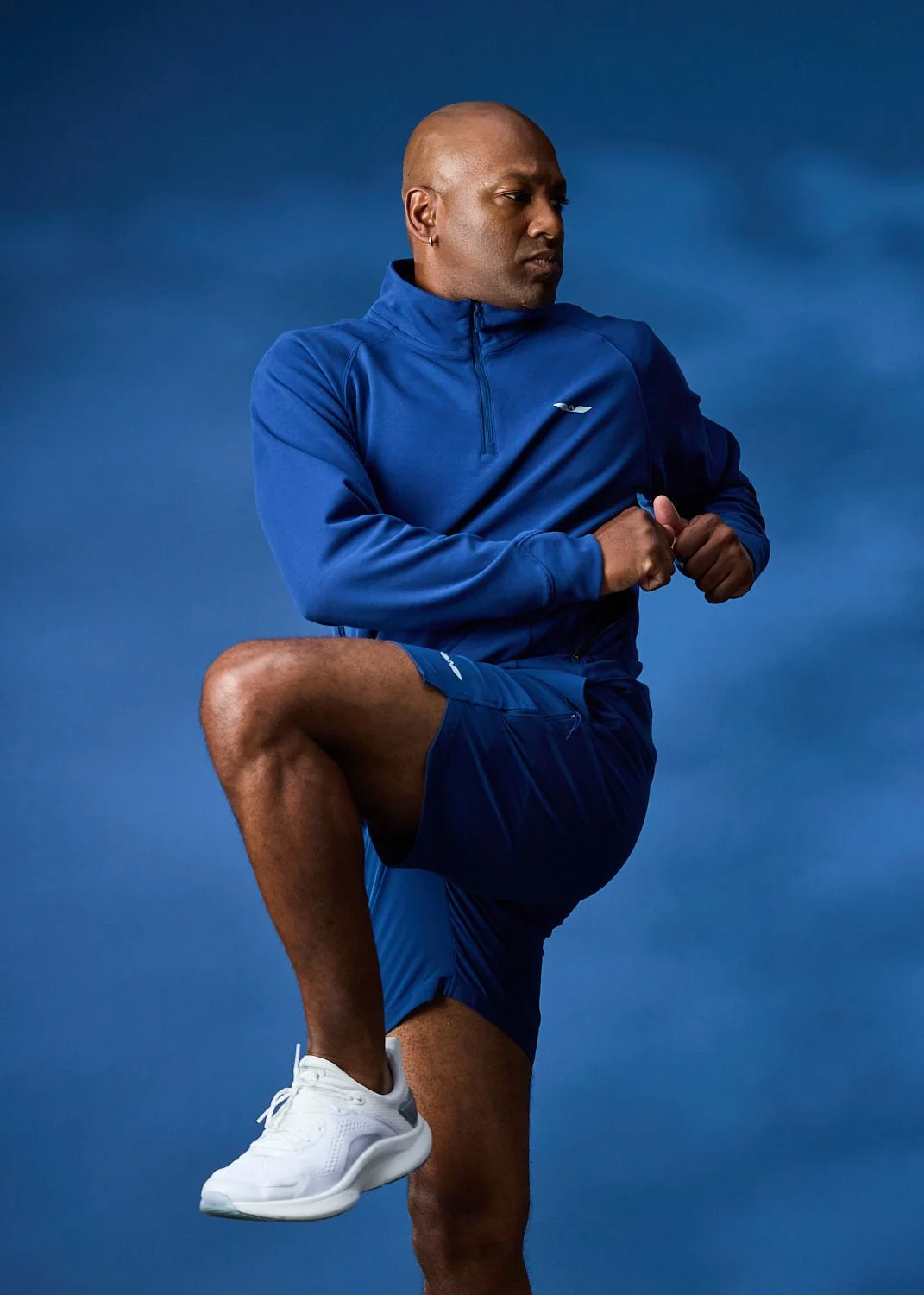 Mens blue jacket, photographed with clean studio lighting with blue backdrop