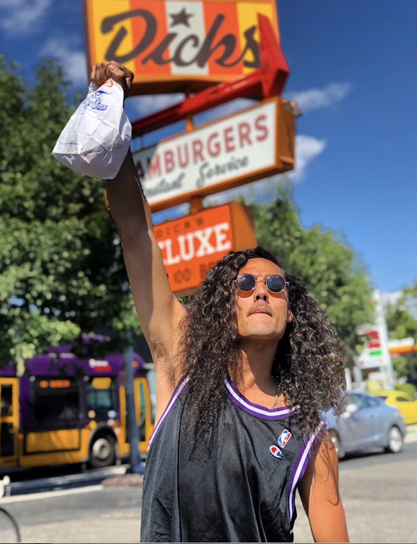man-lifts-bag-high-into-air-pylon-sign-wallingford-dicks-drive-in.png