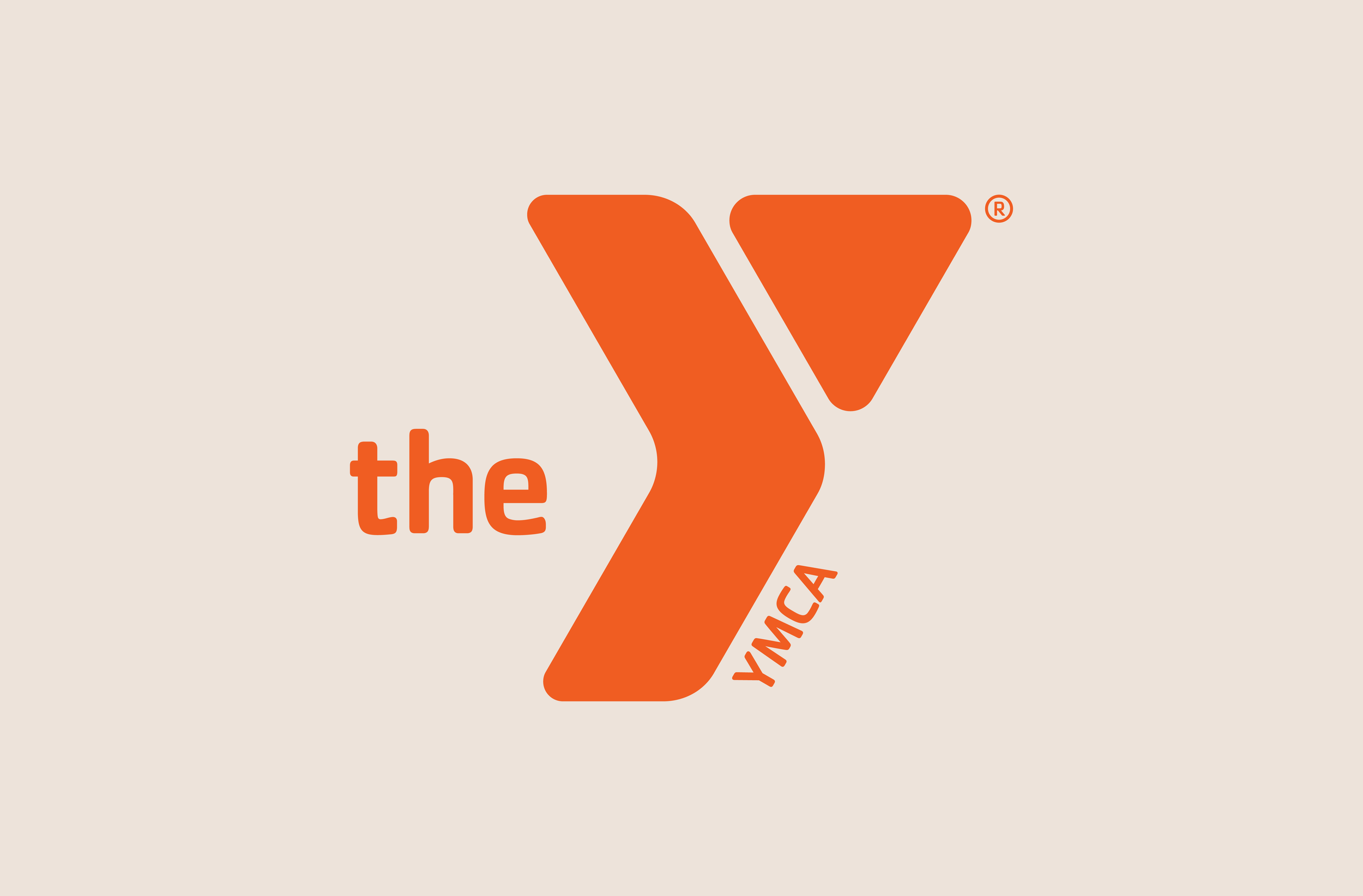 Logo: a large, orange stylized 'Y' and the word 'the' to the left of it, with the text 'YMCA' at an angle at the base of the 'Y' on right, on a light beige background.