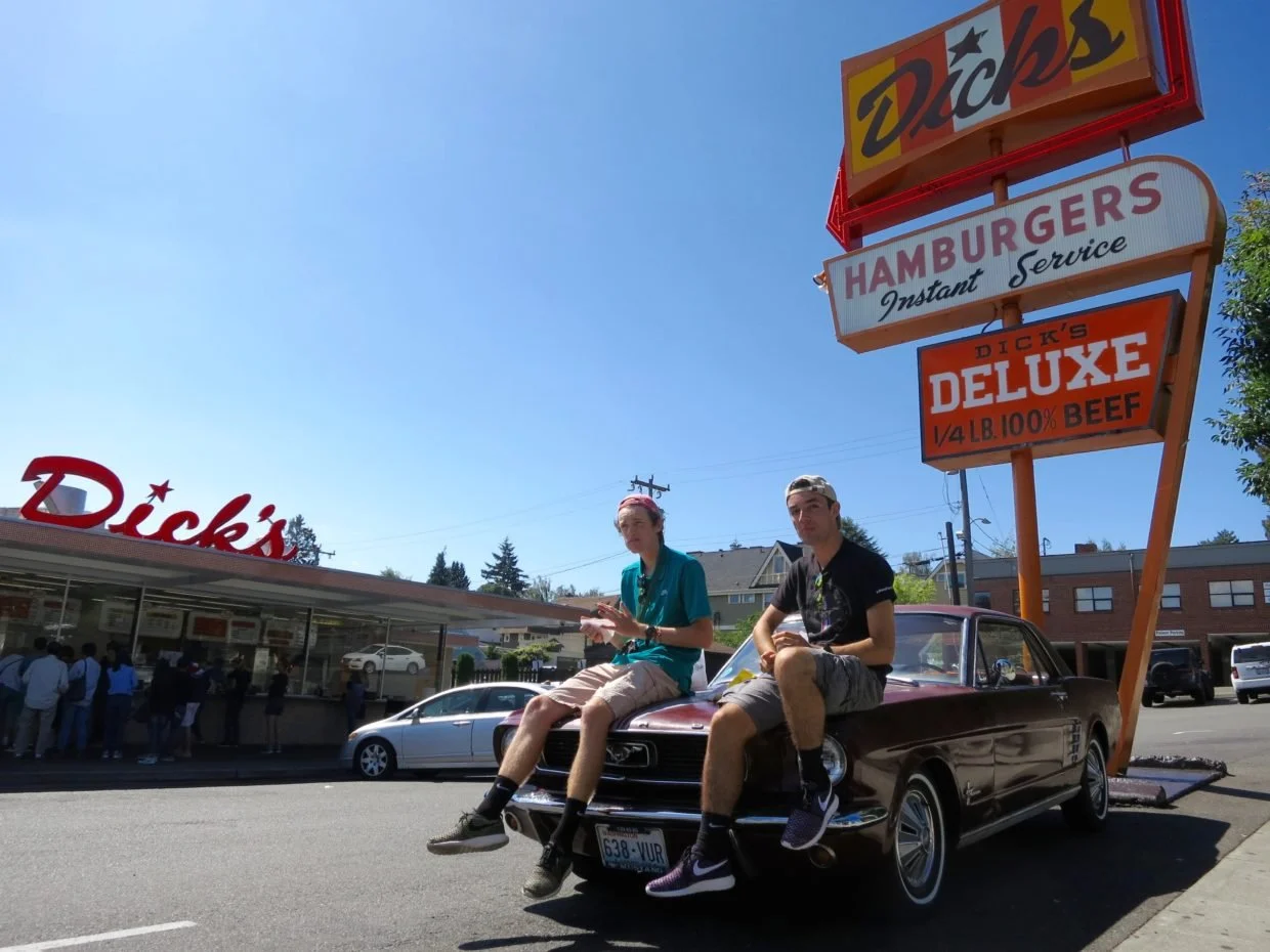 two-guys-sitting-on-hood-classic-mustang-wallingford-dicks-drive-in.jpg