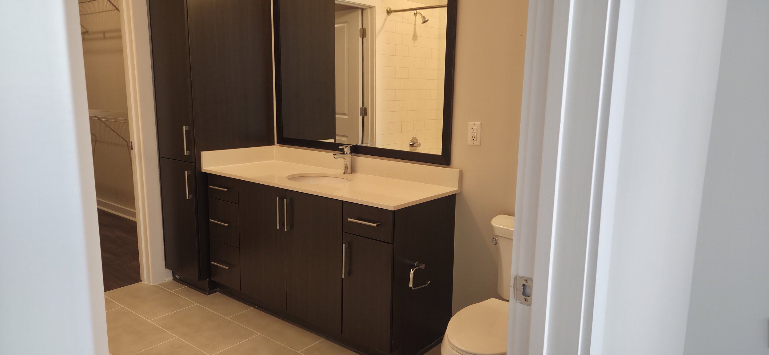 Turn-ready apartment bathroom renovation in Charleston SC featuring new vanity, fresh paint, and detailed make ready services by MakeReady Masters.