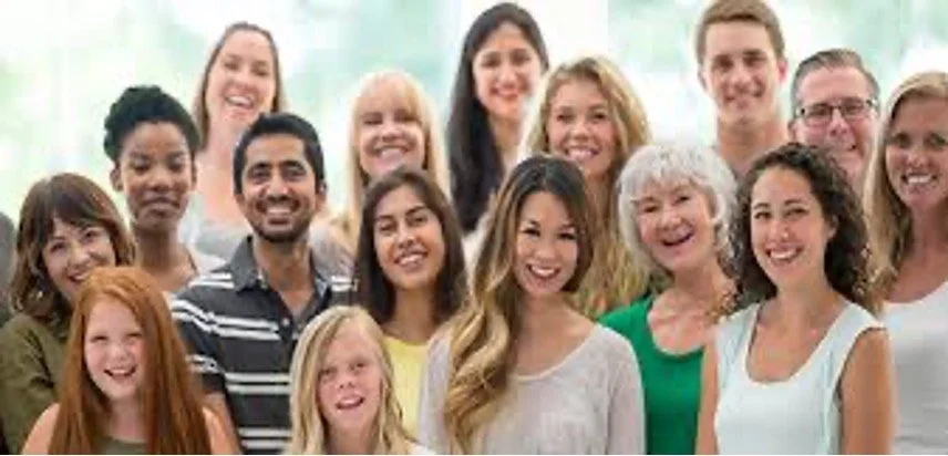 Teen Counseling Conroe Tx, A diverse group of smiling people of various ages and ethnicities gathered together for a group photo.