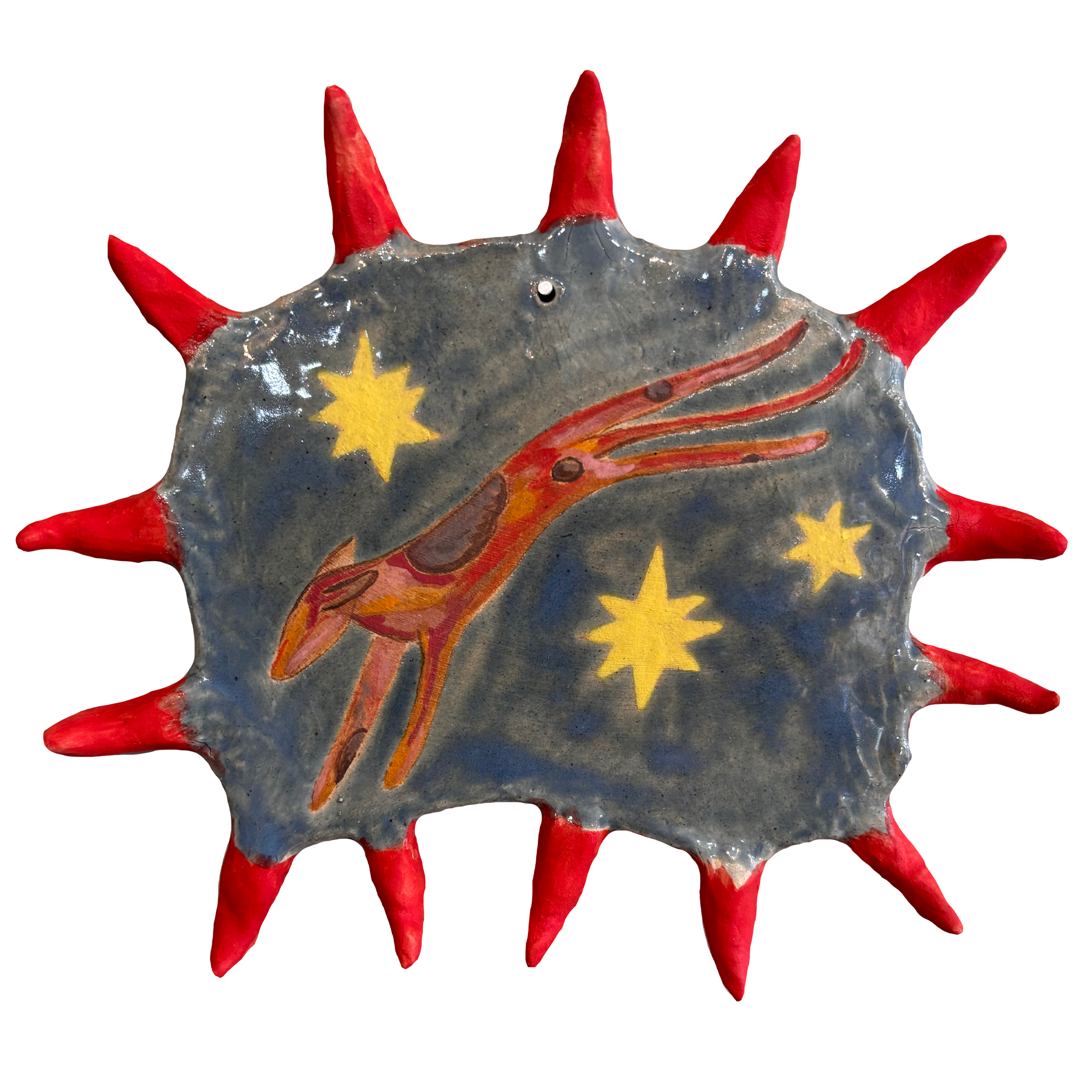 Decorative ceramic plate with a painted pterodactyl dinosaur, yellow stars, and a space background, surrounded by red spikes.