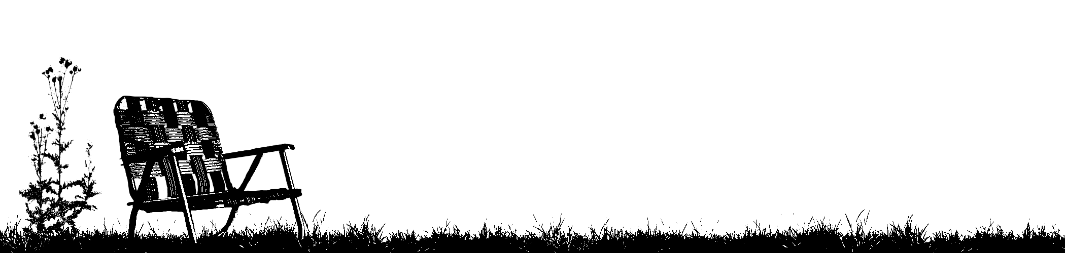 A black and white silhouette of a lawn chair on grass with a dark sky background.