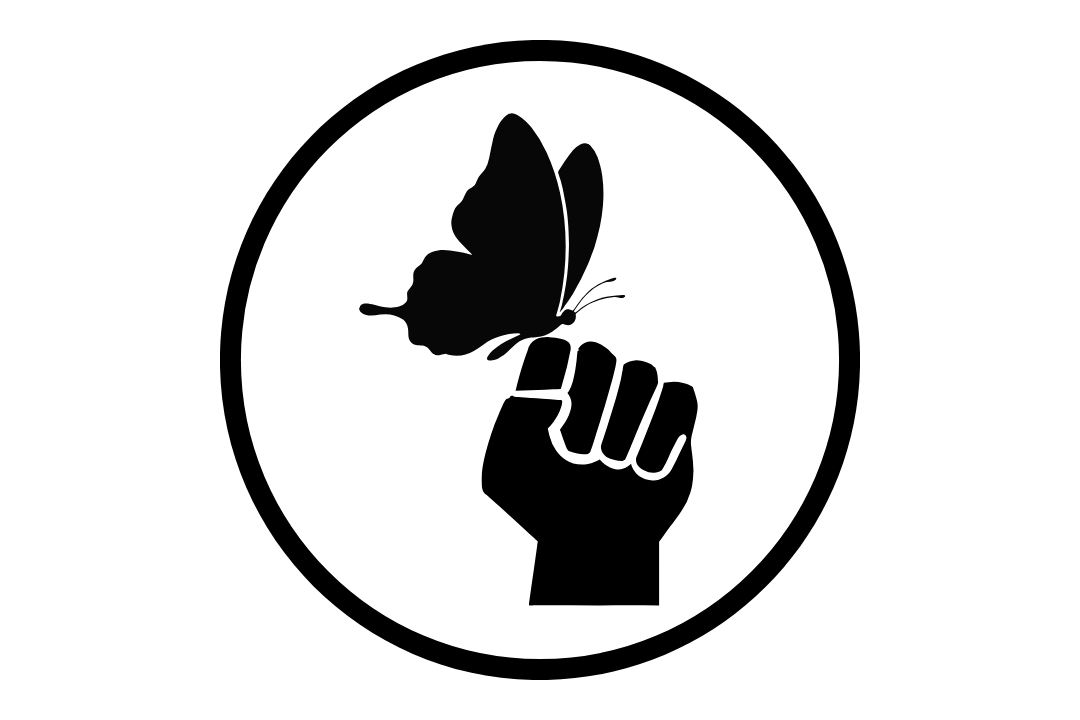 Silhouette of a butterfly on someone's fist. It represents soul sovereignty and the power of choice.