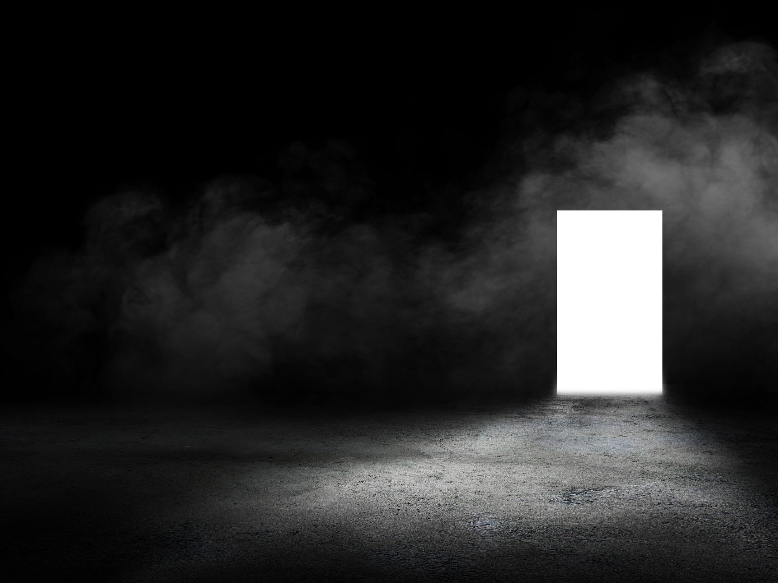 A dark room with a textured floor and a large white panel on the right side, casting light onto the floor, amid swirling smoke or fog in the background. This is a portal to help you go inside.