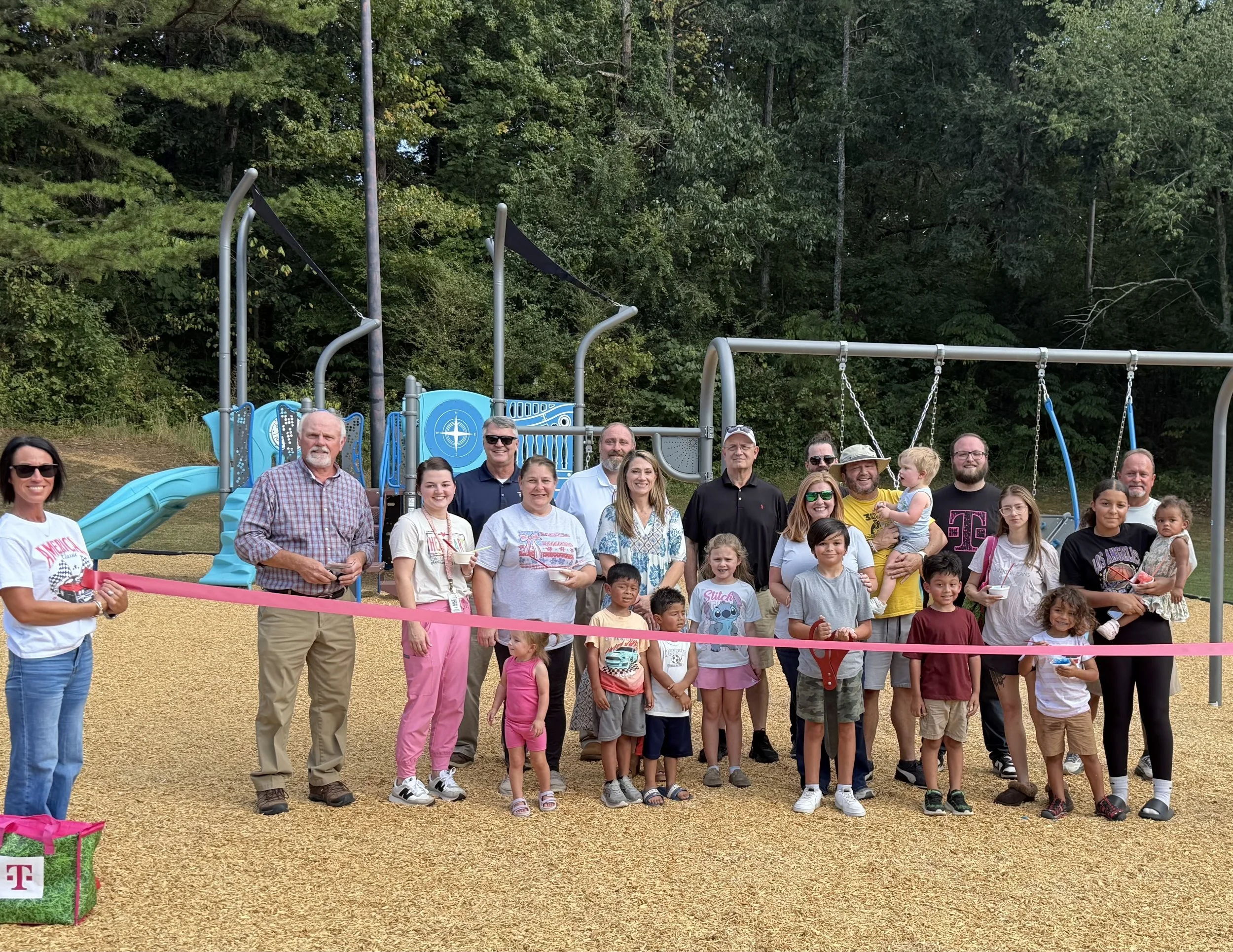Ribbon cutting a celebration of team effort that went into new City Lake Park playground
