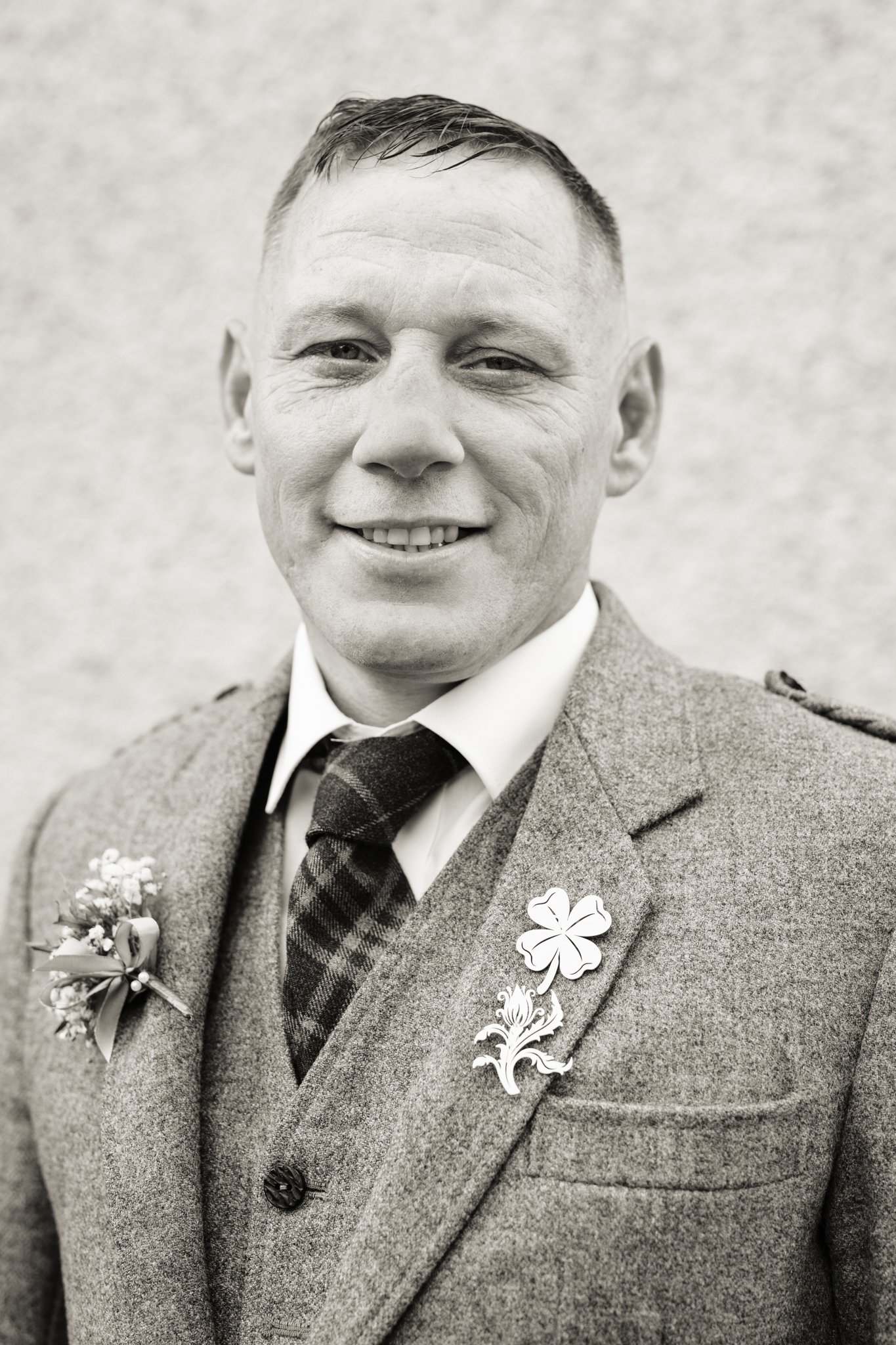 Portrait of groom at his home before wedding. Glasgow based Love Burds Media specialises in affordable wedding photography and short form video content across Scotland. 