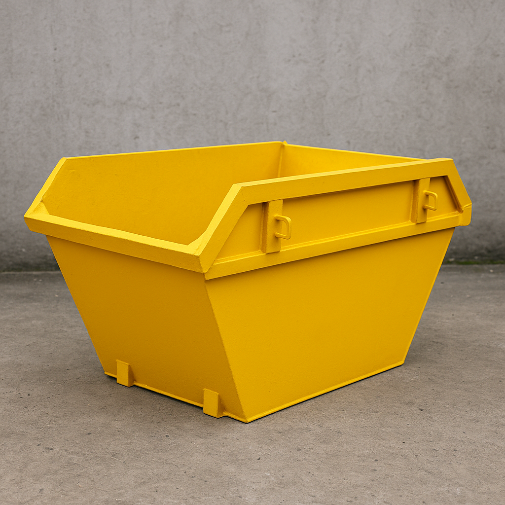 Yellow industrial bin on a concrete floor against a gray wall.