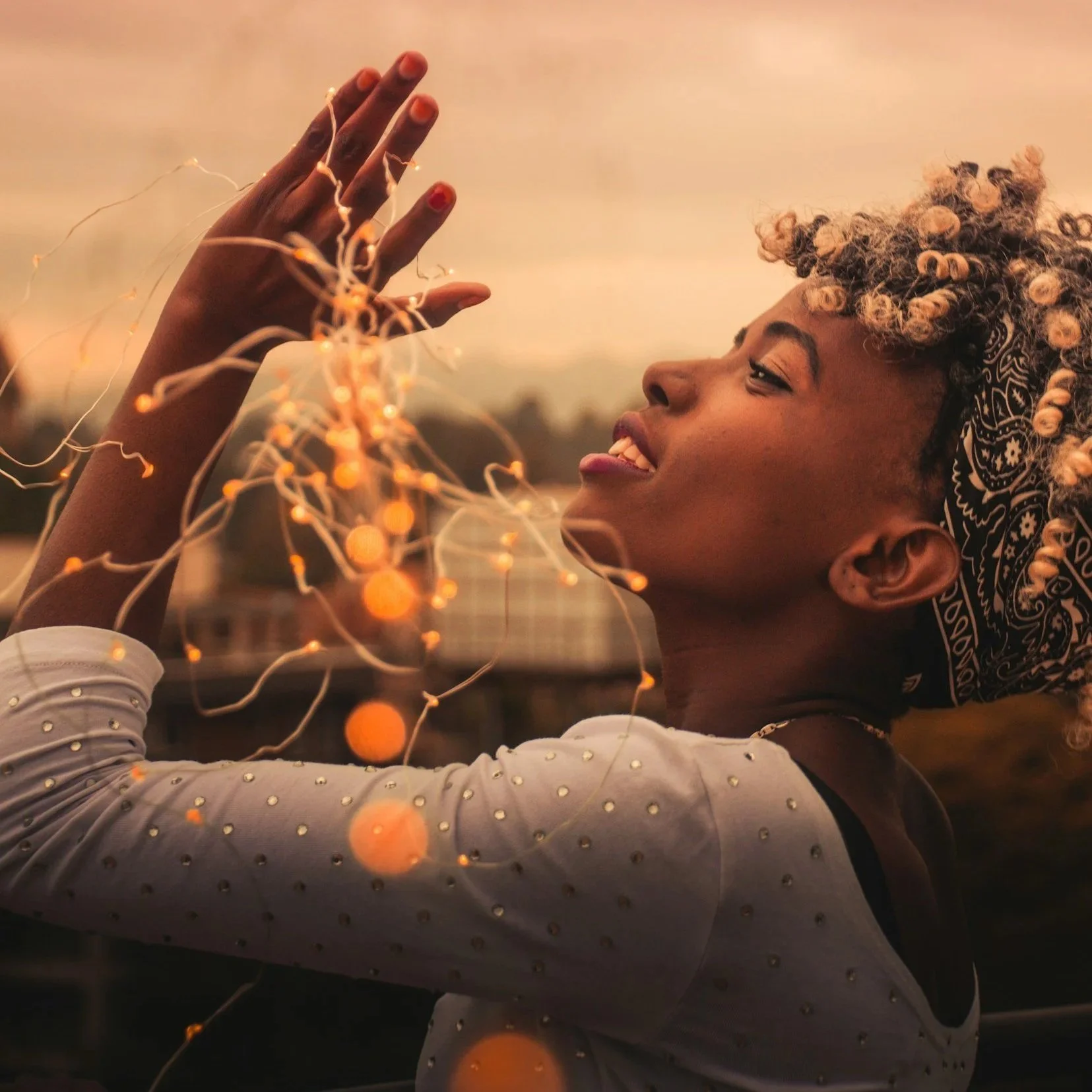 a woman happy to be healed, she is resiliant, strong a woman of color and pride