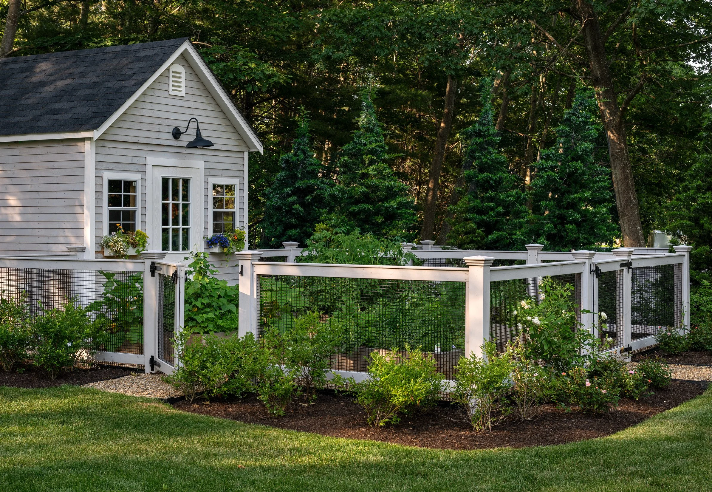 Oak Road Estate features a stunning inground pool, a modern barn-style farmhouse, and a beautifully cultivated garden. Designed by Sea Laurel Landscape Architecture, this property blends refined outdoor living with timeless New England charm.