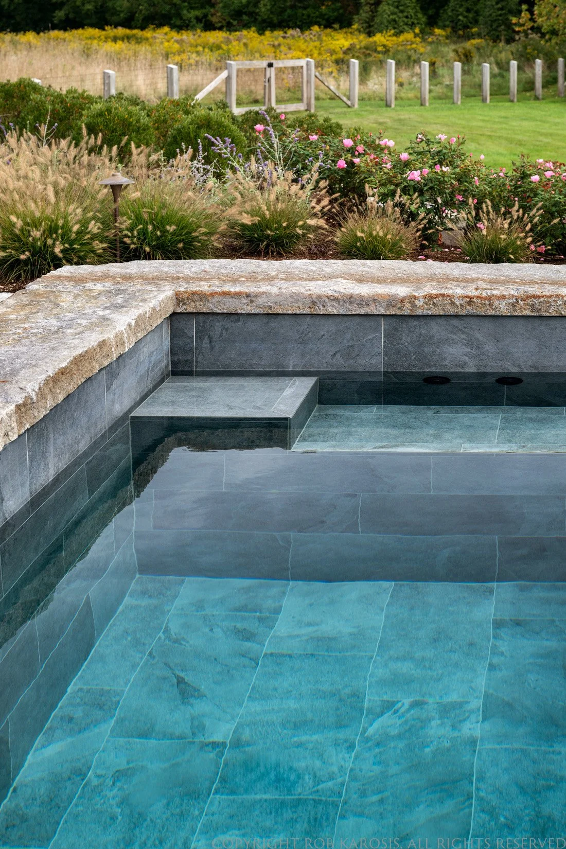 Meadow Residence features expansive meadowland, a beautifully integrated hardscape design, and a charming children’s playhouse. Thoughtfully crafted by Sea Laurel Landscape Architecture, this project blends natural New England beauty with functional,