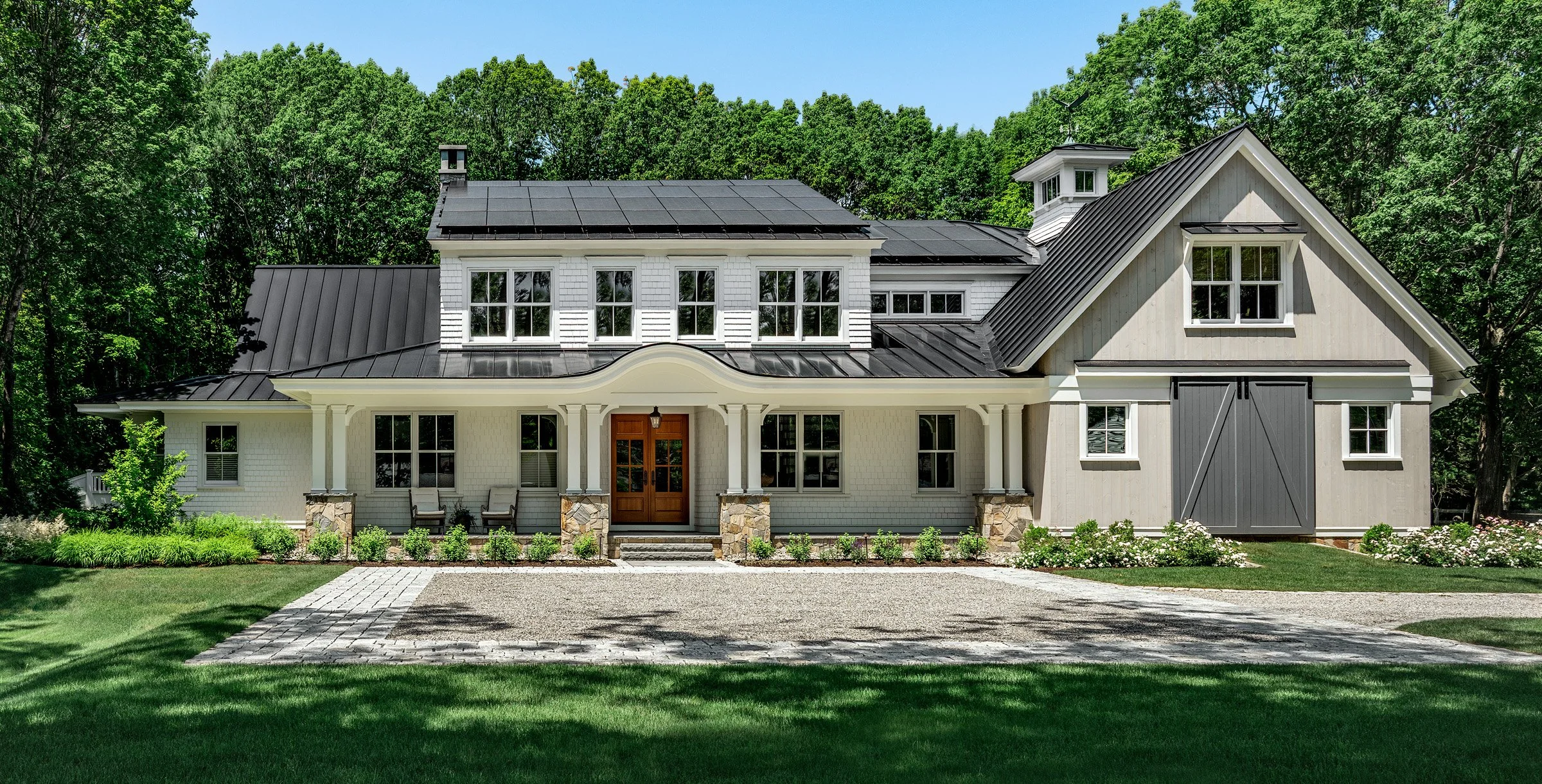 Oak Road Estate features a stunning inground pool, a modern barn-style farmhouse, and a beautifully cultivated garden. Designed by Sea Laurel Landscape Architecture, this property blends refined outdoor living with timeless New England charm.