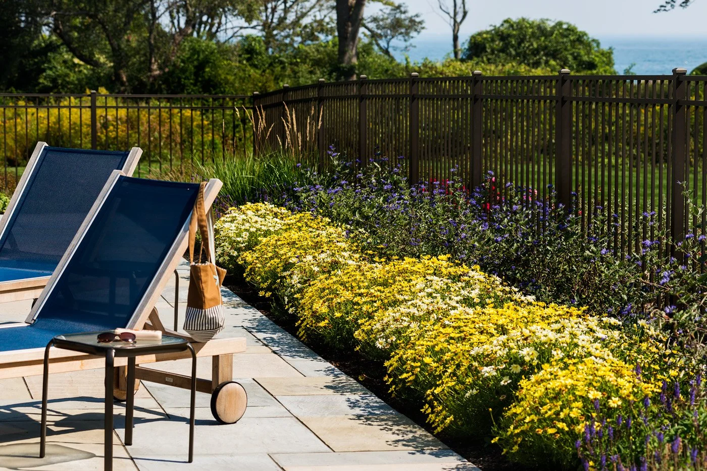 Wildwood Retreat — A New England Home Landscape Architecture and Outdoor Living Design by Vicky Martel of Sea Laurel Landscape Architecture.
This residential project showcases custom landscape design that enhances natural beauty, elevates curb appeal