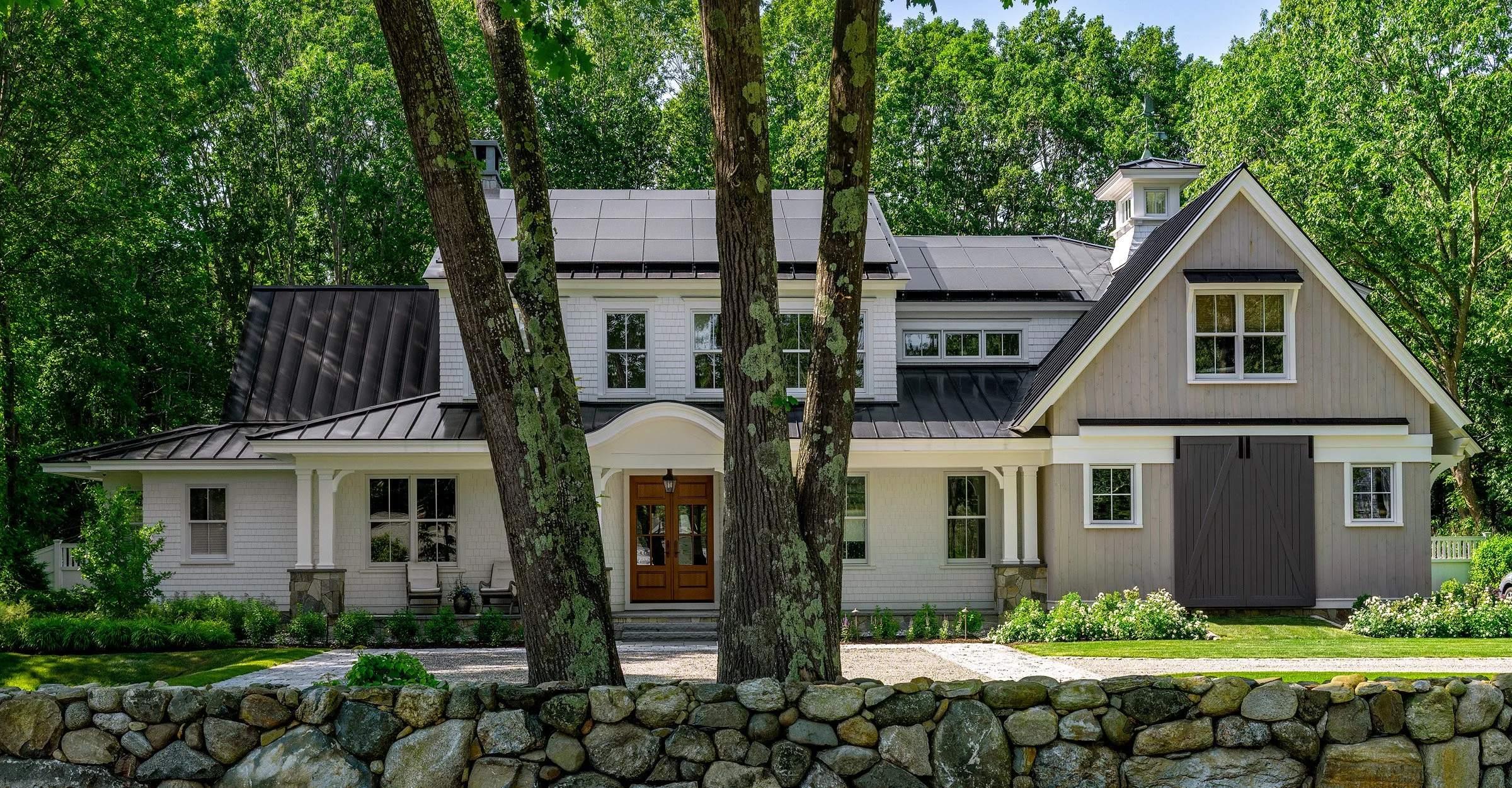 Oak Road Estate features a stunning inground pool, a modern barn-style farmhouse, and a beautifully cultivated garden. Designed by Sea Laurel Landscape Architecture, this property blends refined outdoor living with timeless New England charm.