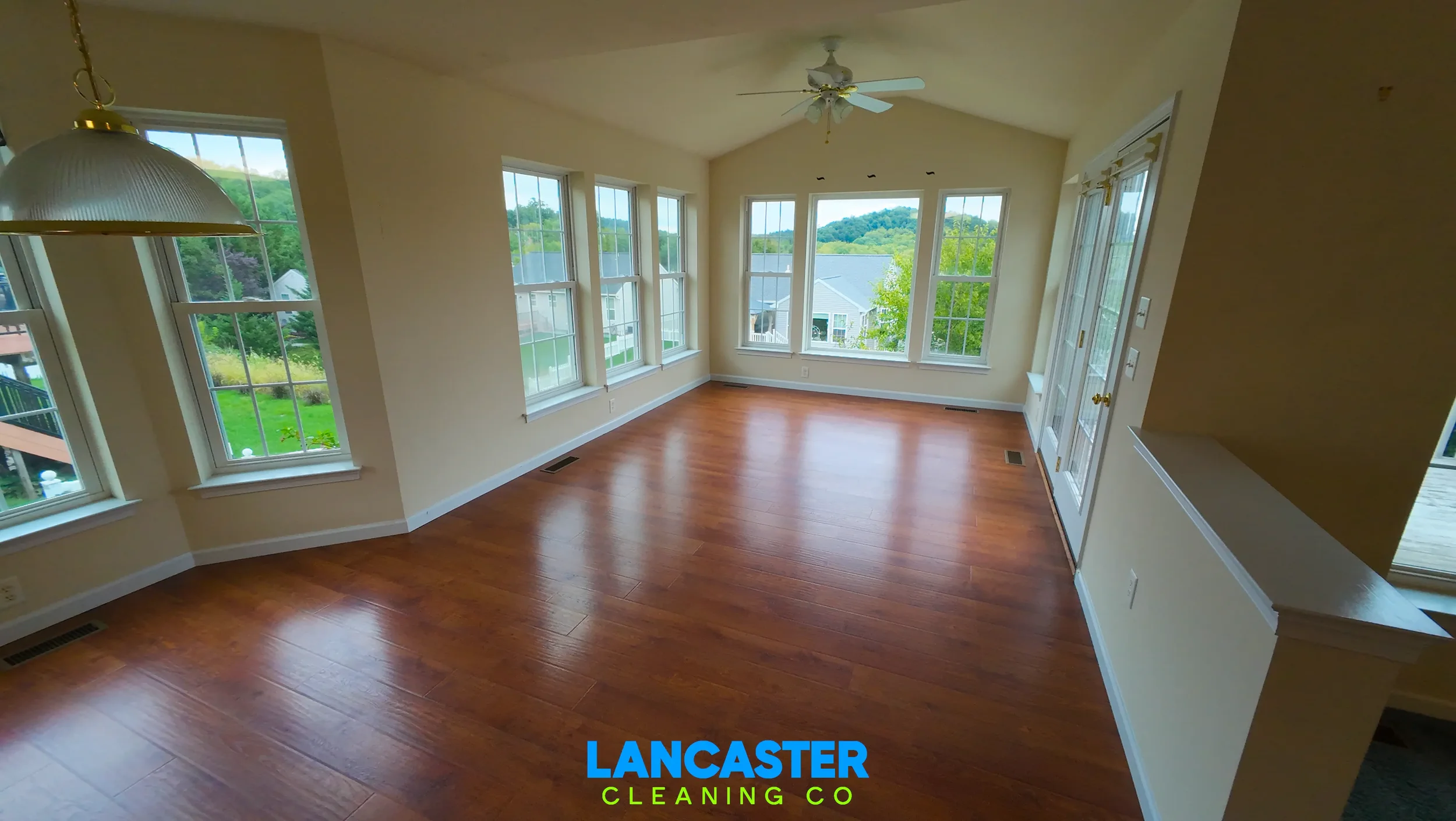 pre-listing move cleaning completed on a home in Denver, PA featuring mopped floors, hand-washed baseboards, streak-free window cleaning, and light fixture dusting in a large sun room