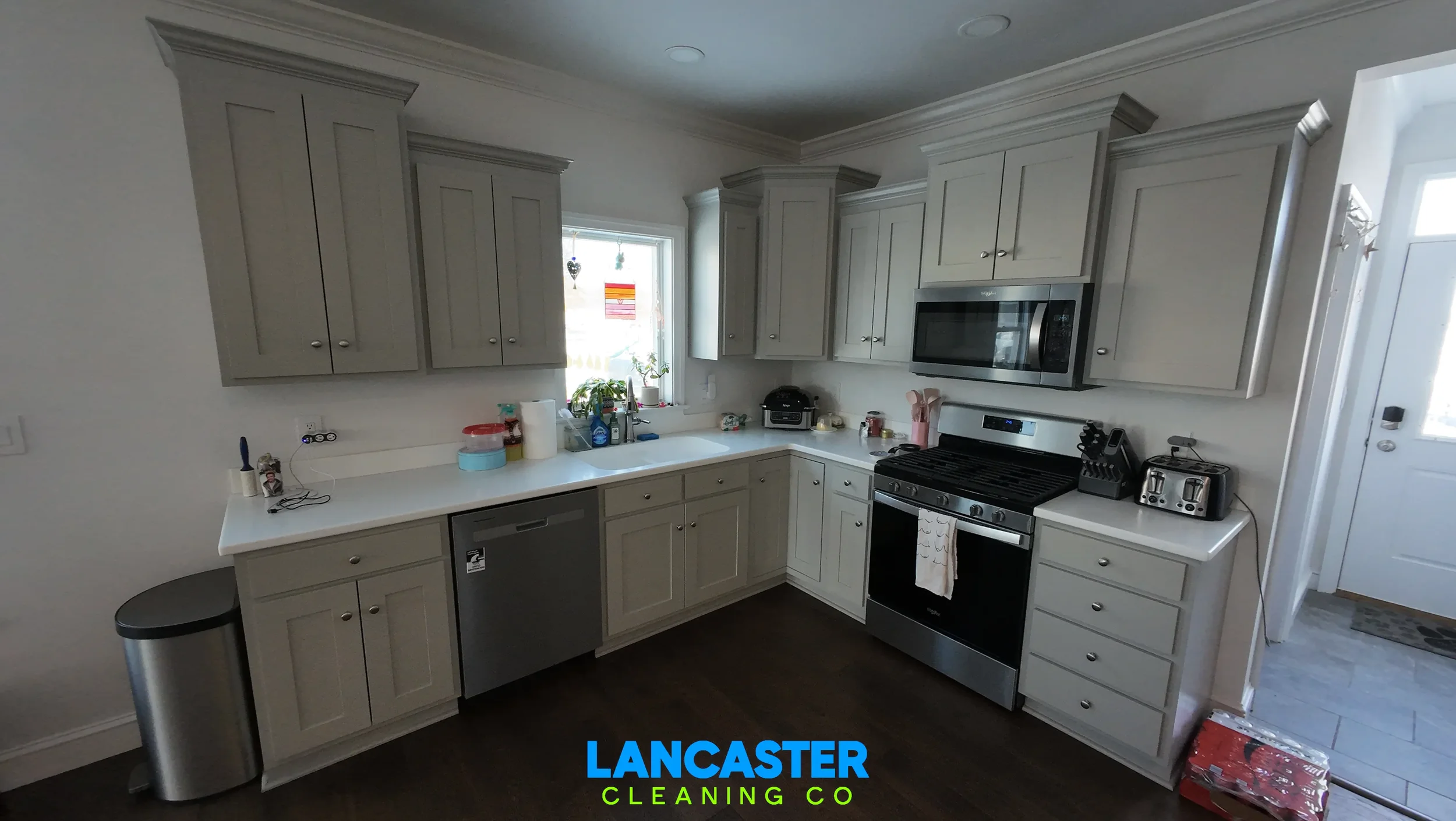 Lancaster, PA kitchen after a professional deep house cleaning service, including detailed cleaning of cabinets, countertops, stainless steel appliances, inside the oven, and inside the refrigerator.