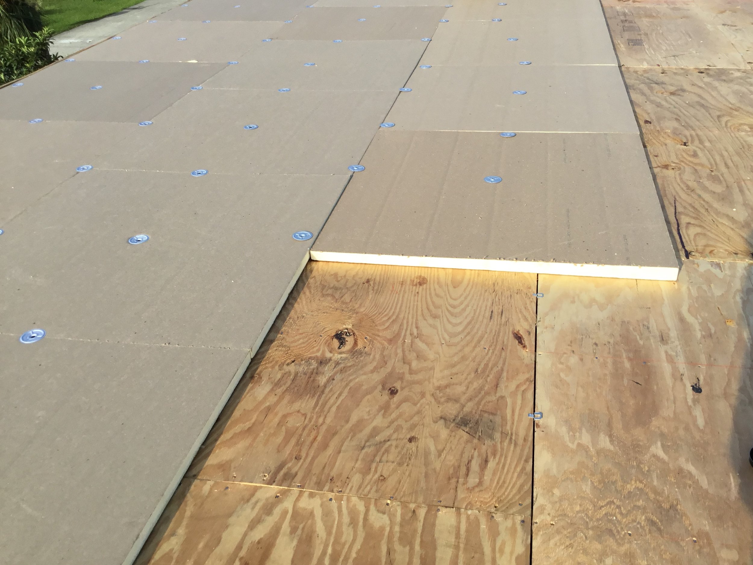 Tapered insulation installed over a low-slope flat roof to intentionally create pitch and improve drainage. This method eliminates standing water, directs runoff toward scuppers or drains, and provides a stable base for the final waterproof membrane 
