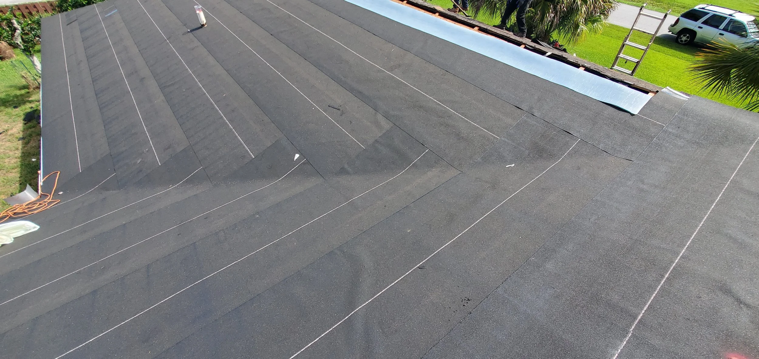Seamlessly installed peel-and-stick underlayment — commonly called ice & water barrier — laid tight, flat, and wrinkle-free across the deck. This self-adhered membrane bonds directly to the roof, creating a secondary waterproof layer that protects ag