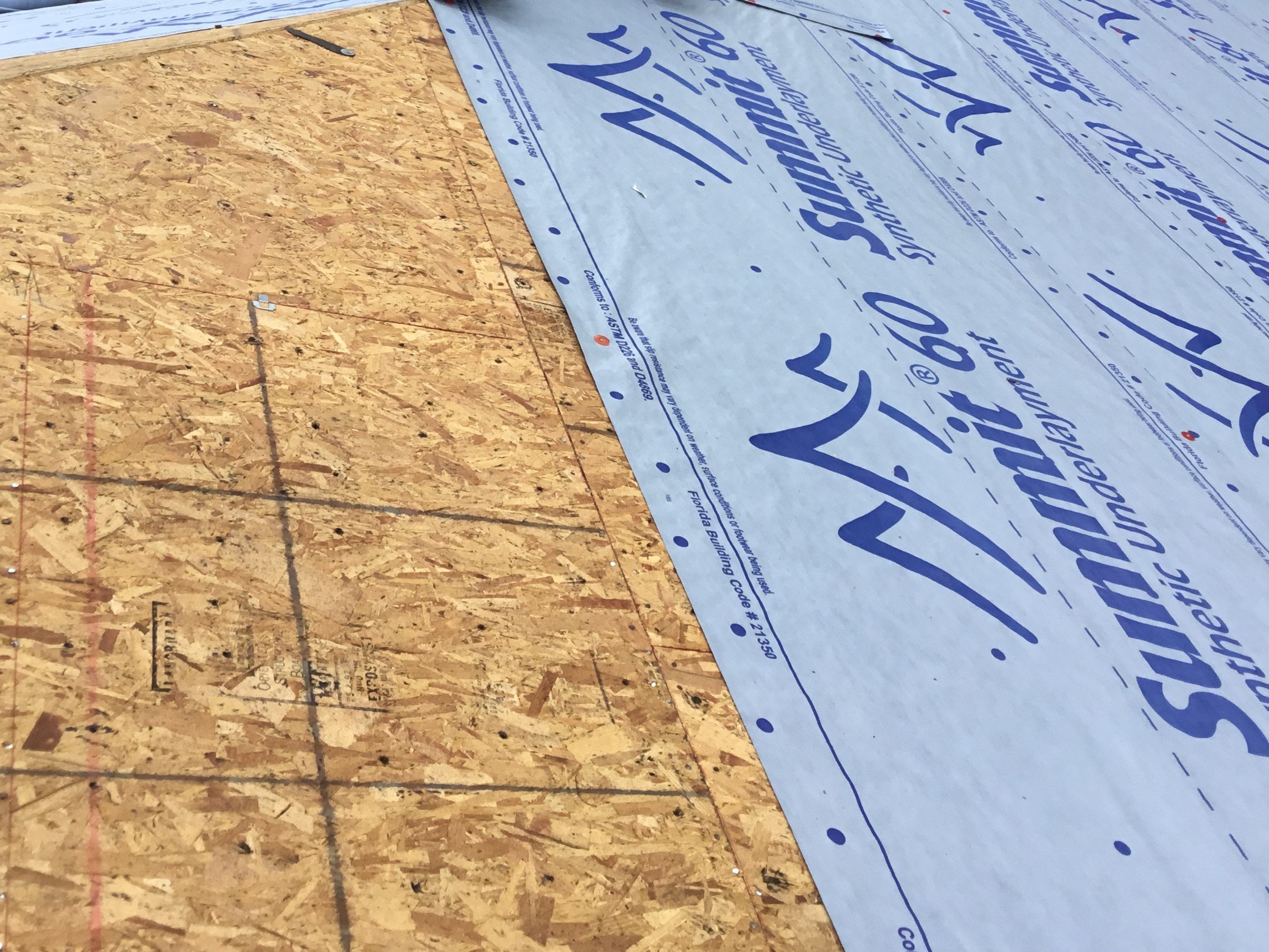 High-performance synthetic roof underlayment laid over decking prior to shingle installation, providing a durable secondary water barrier. Unlike traditional felt, this advanced underlayment resists tearing, improves walkability, and offers superior 