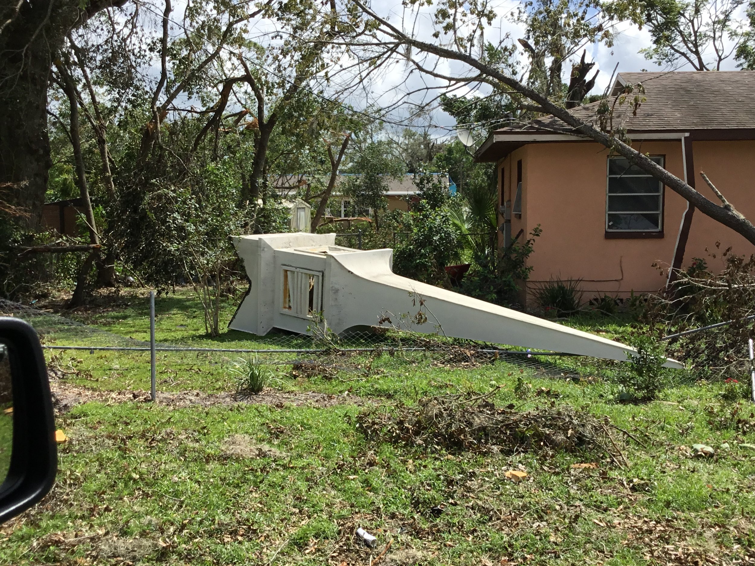 Church steeple in DeLand knocked to the ground by a tornado, illustrating the extreme forces that severe storms can place on roof structures. The collapsed steeple left the roof fully exposed, making immediate emergency tarping and a complete structu
