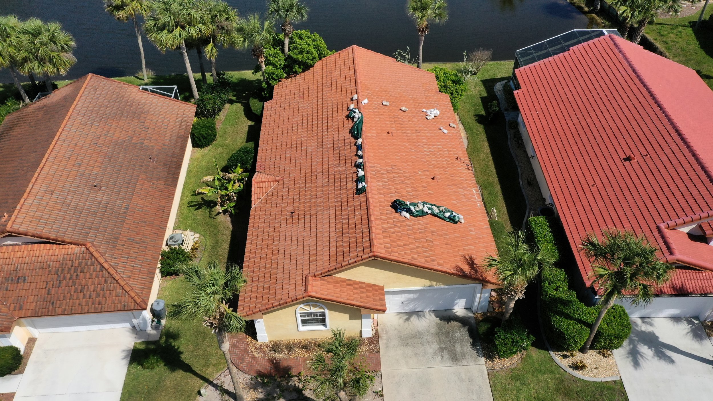 Aging asphalt shingle roof showing surface wear, granule loss, and uneven texture typical of a system near the end of its service life. Roofs in this condition are more vulnerable to wind damage and leaks, making proactive replacement the most reliab