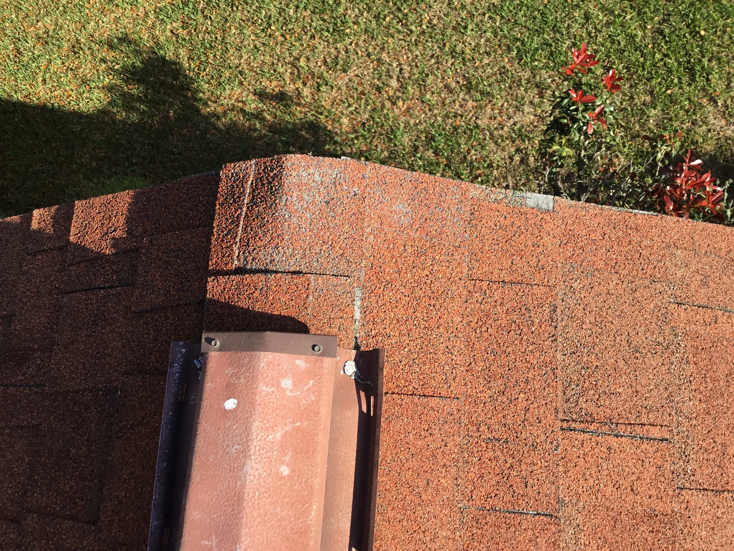 Advanced granule loss and surface breakdown along the rake and ridge of an aging asphalt shingle roof, where exposure to sun, heat, and wind accelerates deterioration. These high-stress edges are often the first to fail, increasing the risk of leaks 