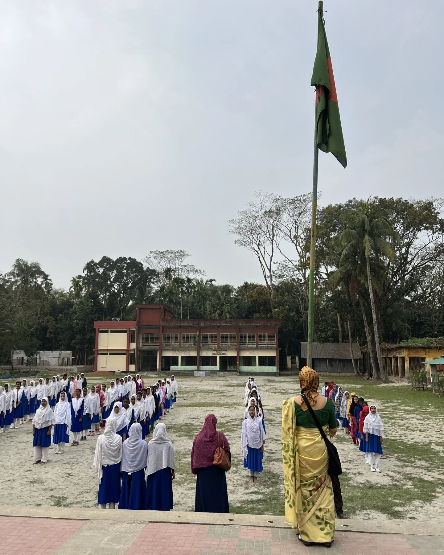 Prof Dil Afroze Quader (co-founder) hoisting national flag at the morning assembly, February 2025.