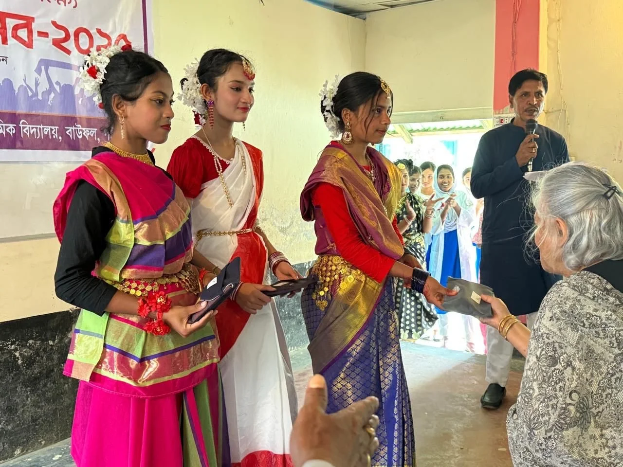 Dr Sadia Chowdhury giving performance prizes