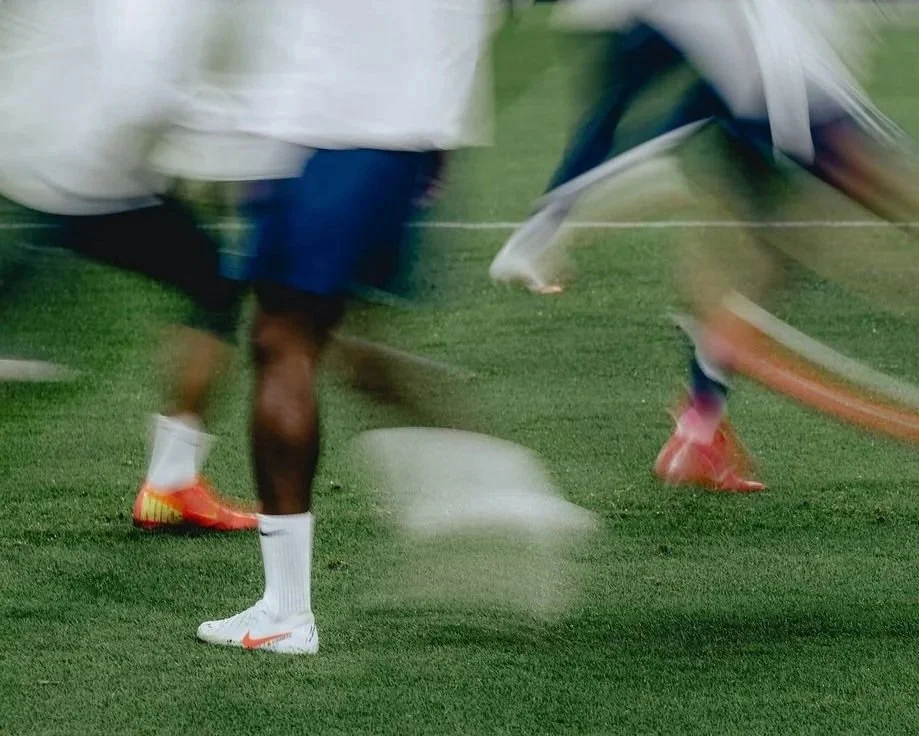 Soccer player dribbling ball during professional training session