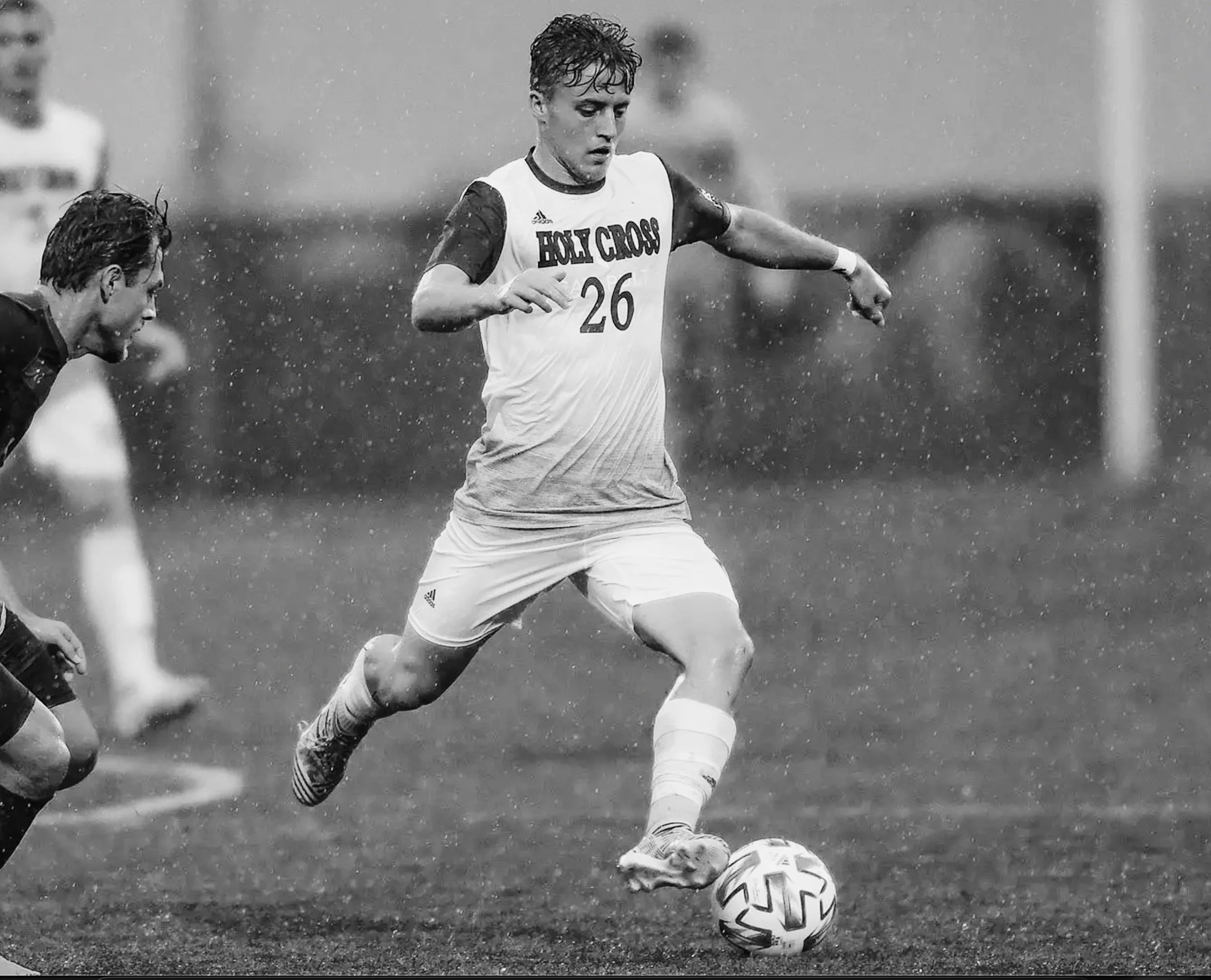 Jake Williams playing college soccer for College of the Holy Cross