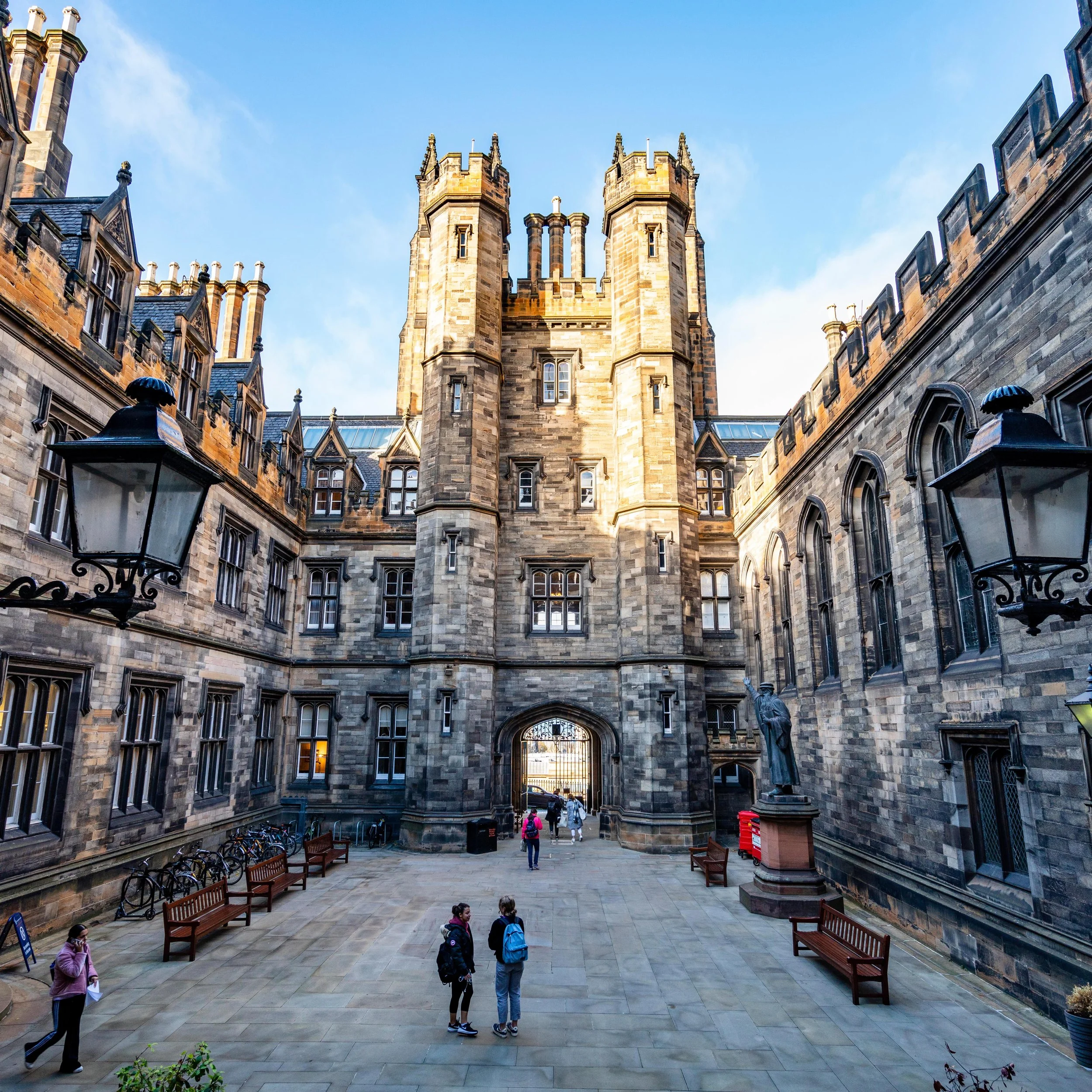 Graduate students celebrating masters degree completion in Scotland