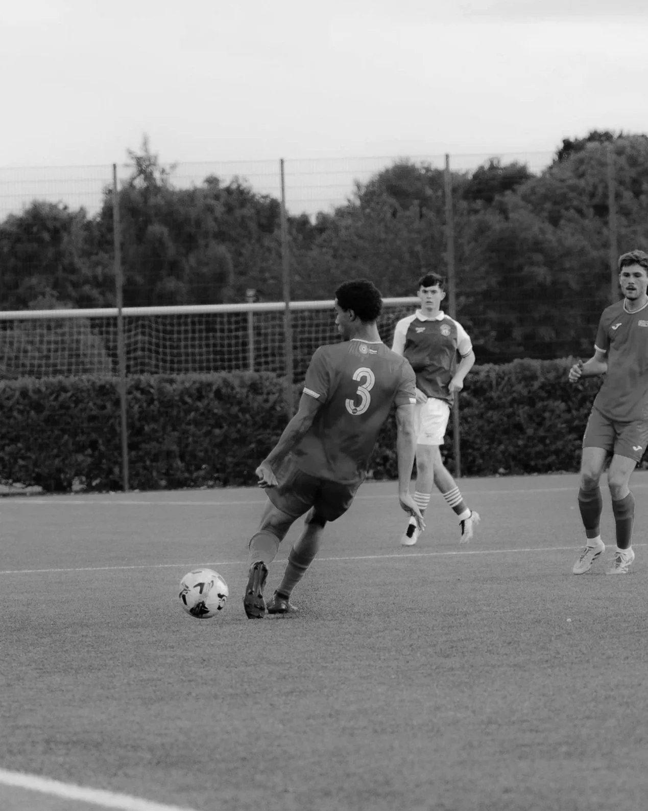 Adrian Trott playing college soccer for Amherst College