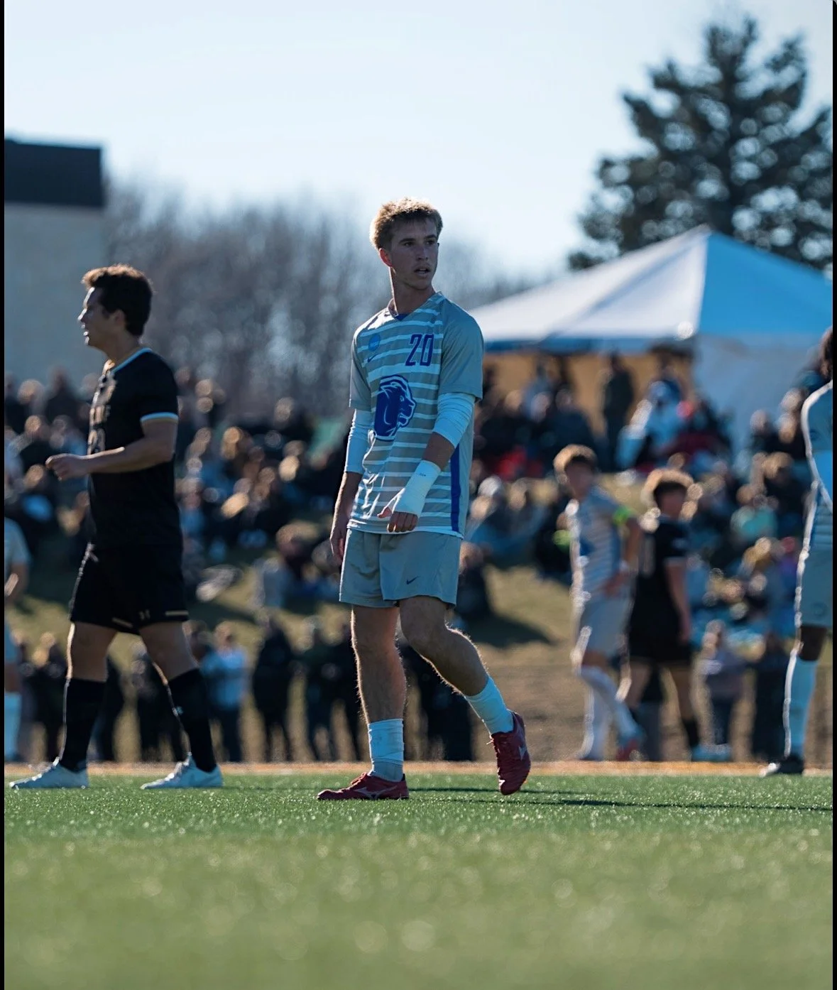 Aidan Doyle playing college soccer for Wheaton College