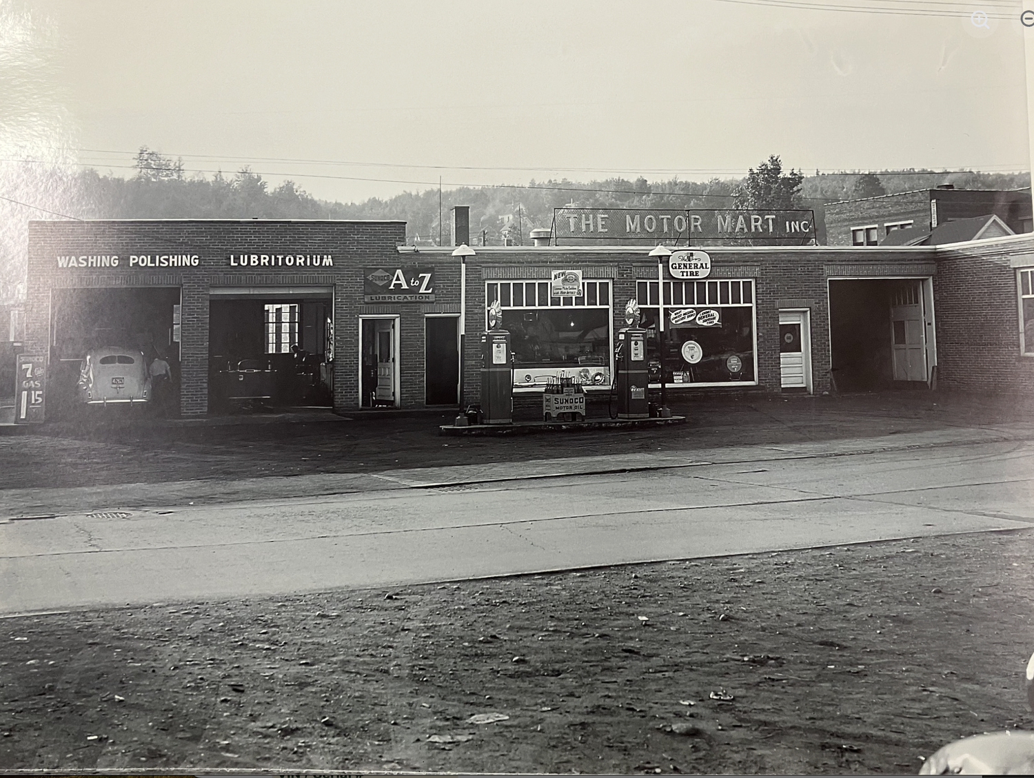 The Motor Mart Inc. at 1327 Main Street, Berlin NH, circa 1940s — washing, polishing and lubritorium bays