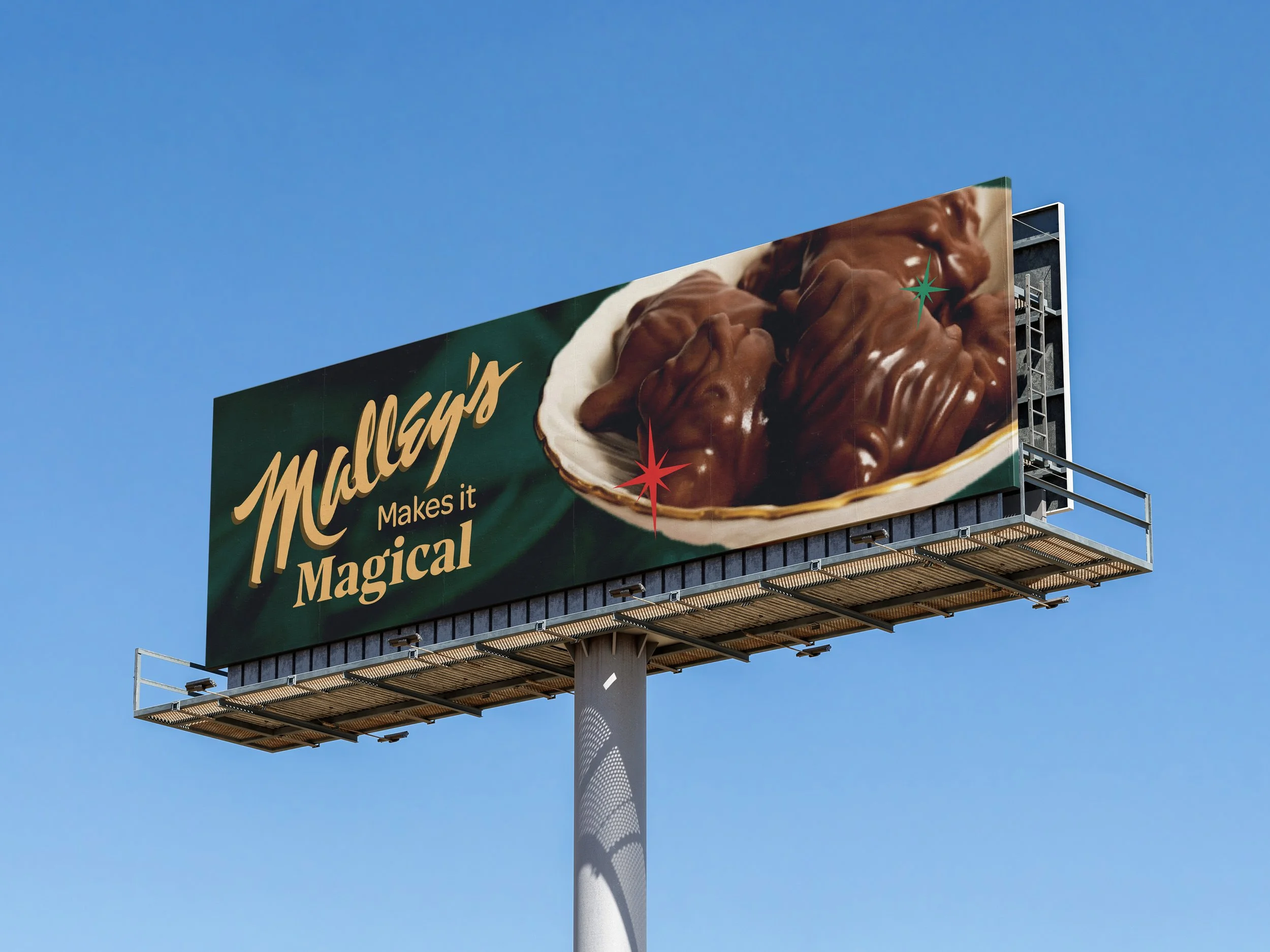 Billboard advertising Malley's chocolate, with a bowl of chocolate-covered treats and the slogan "Malley's Makes it Magical" against a blue sky.