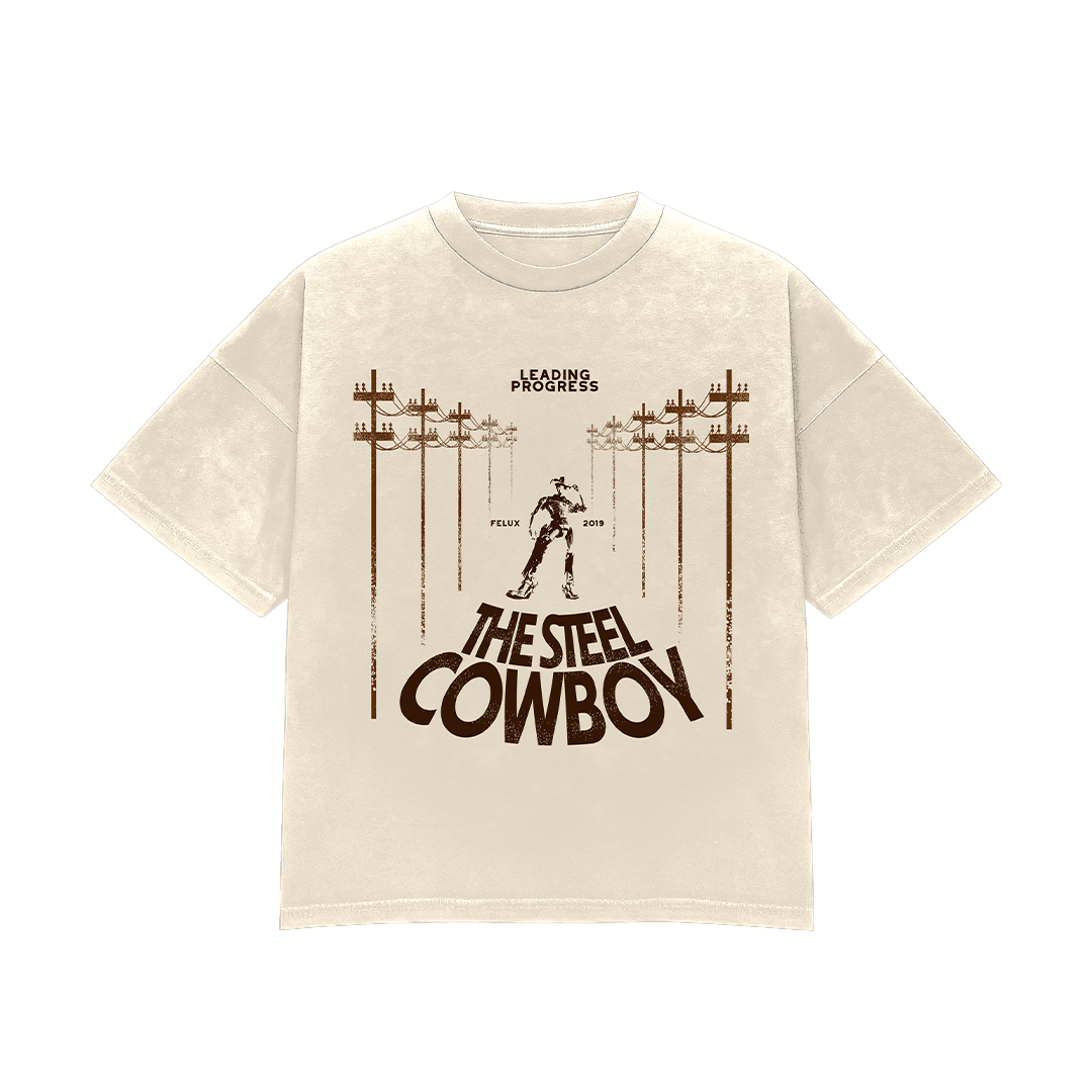White T-shirt with brown graphic design featuring power lines, a cowboy figure, and the text 'The Steel Cowboy'.