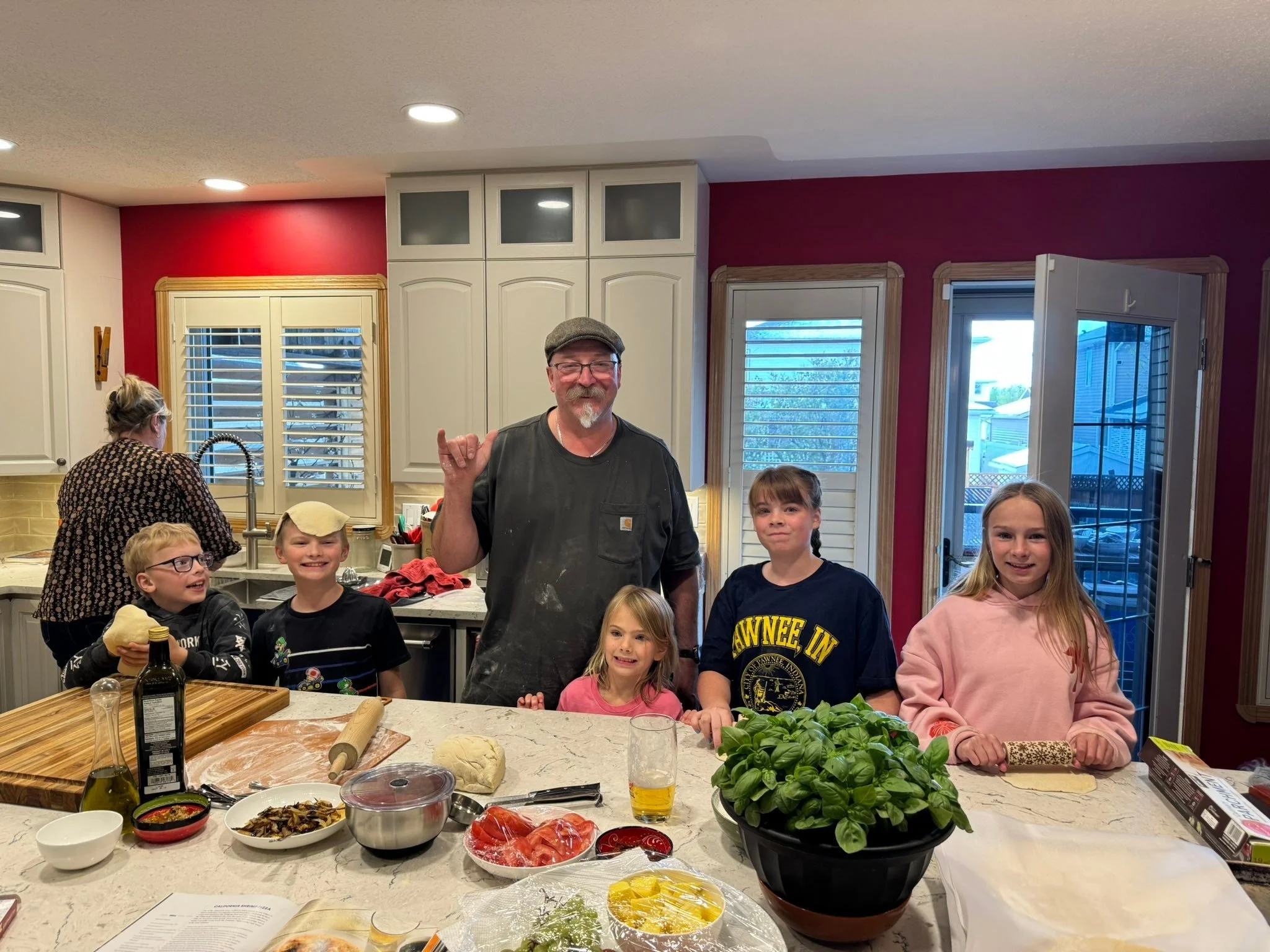 This weekend was remarkably busy with family in town; we concluded it with a pizza party featuring personalized pizzas crafted by the kids and, of course, birthday cake for Terry. Happy birthday Terry.