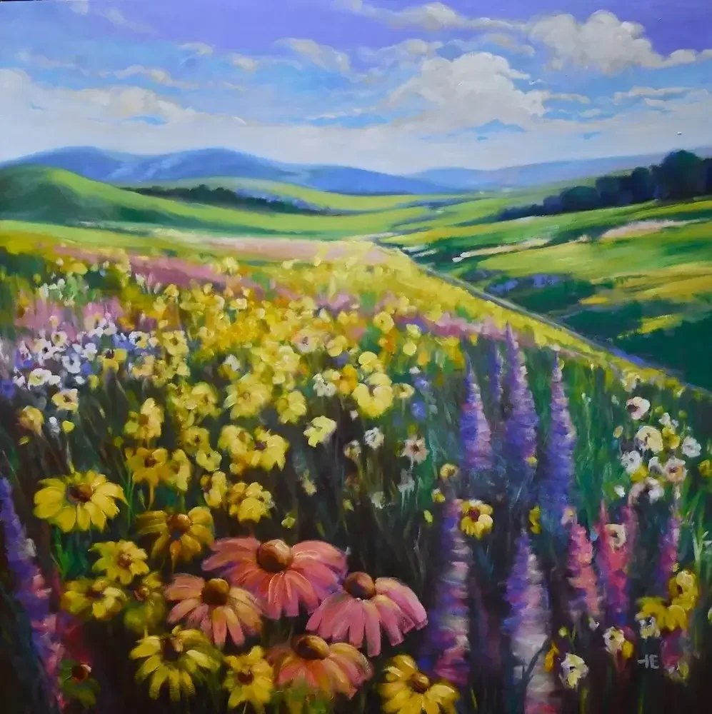 A colorful painting of a vibrant landscape with rolling green hills, a blue sky with clouds, and a variety of blooming wildflowers in the foreground.