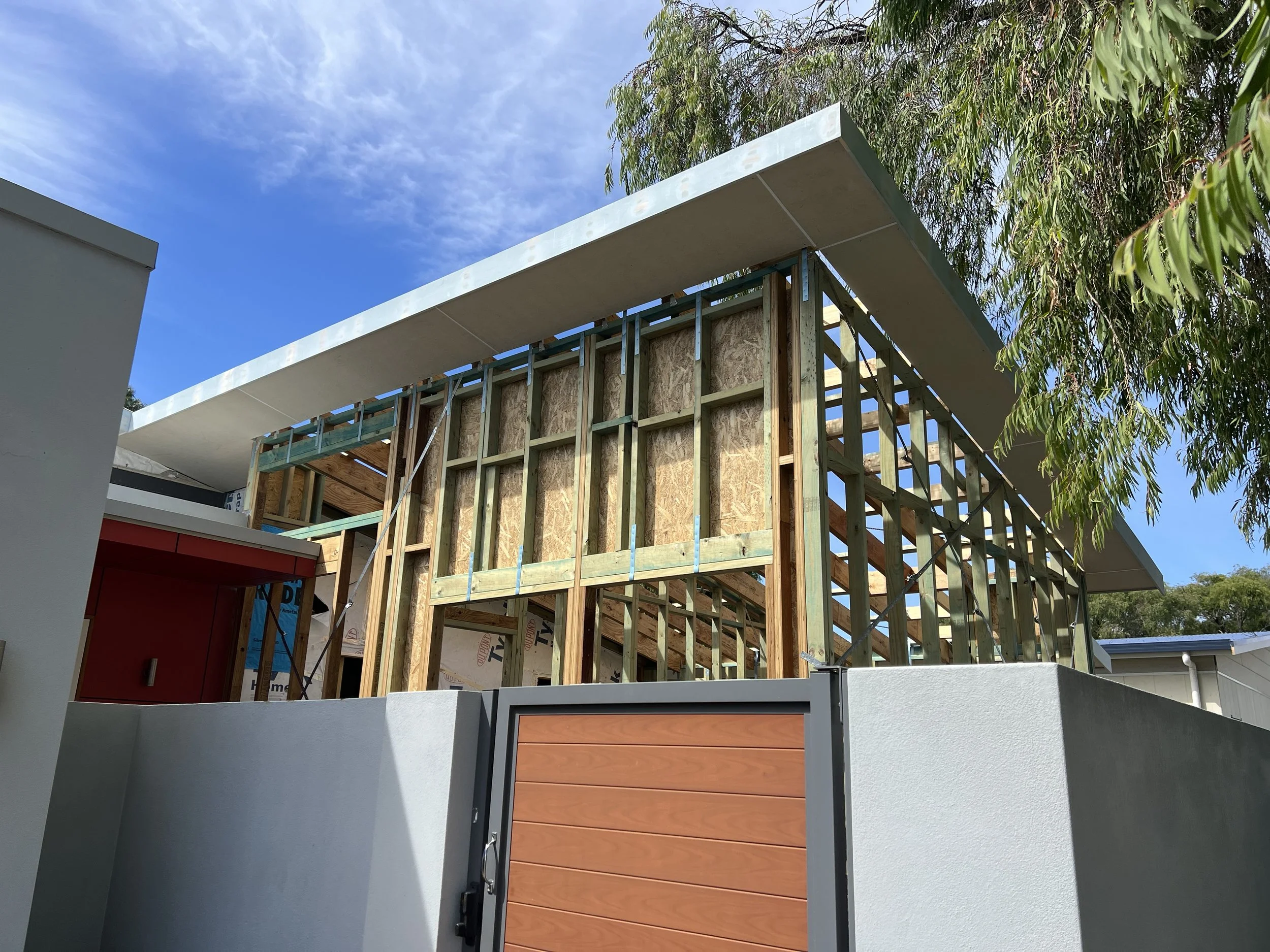 Construction site of a home extensions in progress for modern houses with wooden framing by local yallingup builder