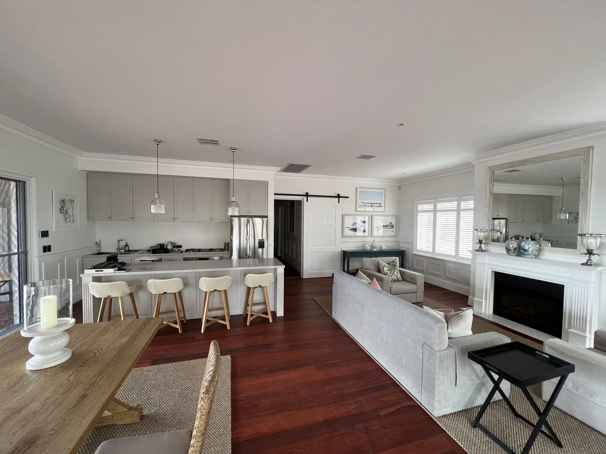 Open-concept living room for family style home by custom home builder