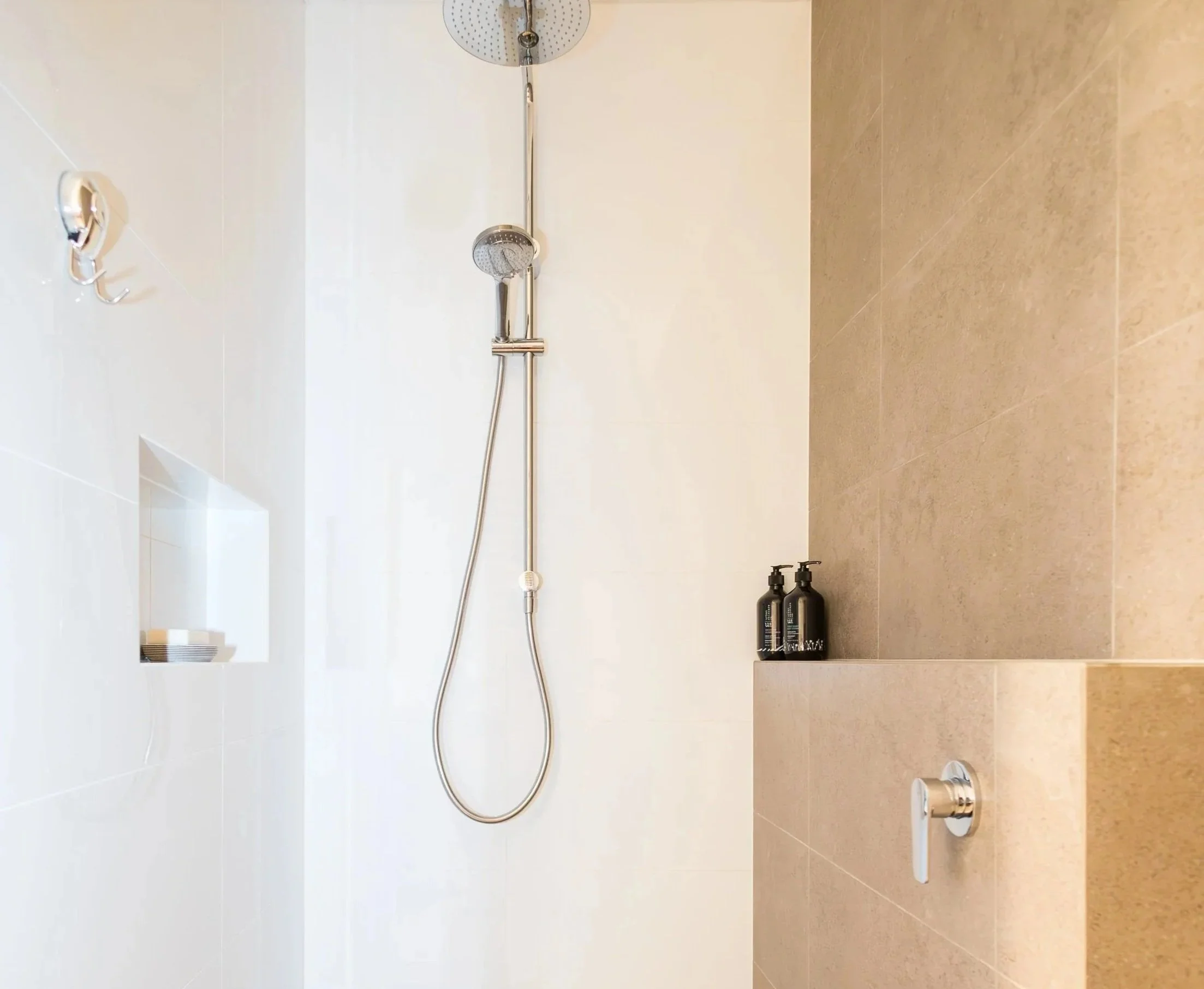 Renovated bathroom shower with ceiling-mounted rain showerhead, renovations by custom builder in busselton