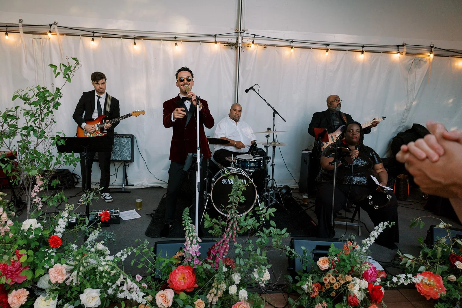 dance floor floral arrangements in front of the band